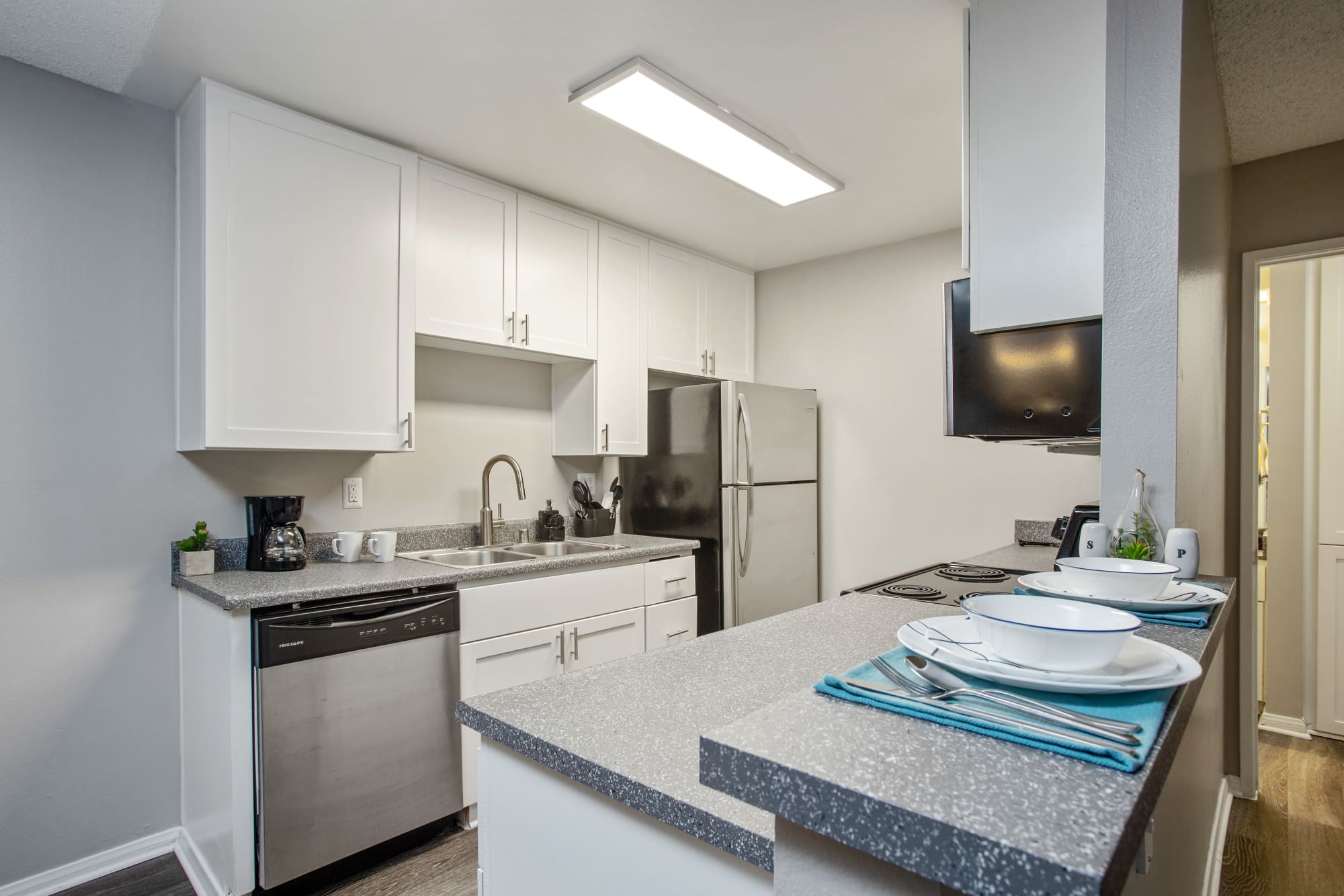 Newly renovated kitchen with stainless steel appliances at Shadow Ridge Apartments in Oceanside, California
