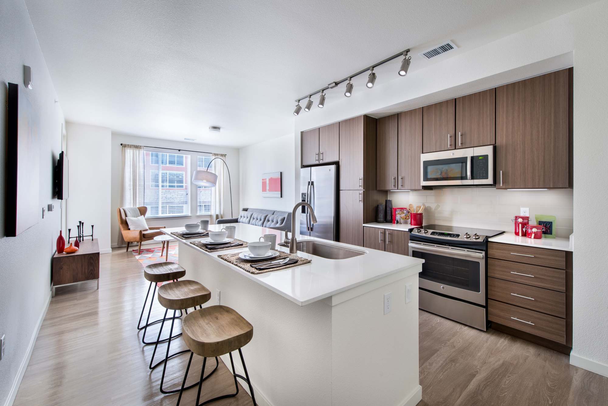 Kitchen with island and counter stools at Elevate in Englewood, Colorado