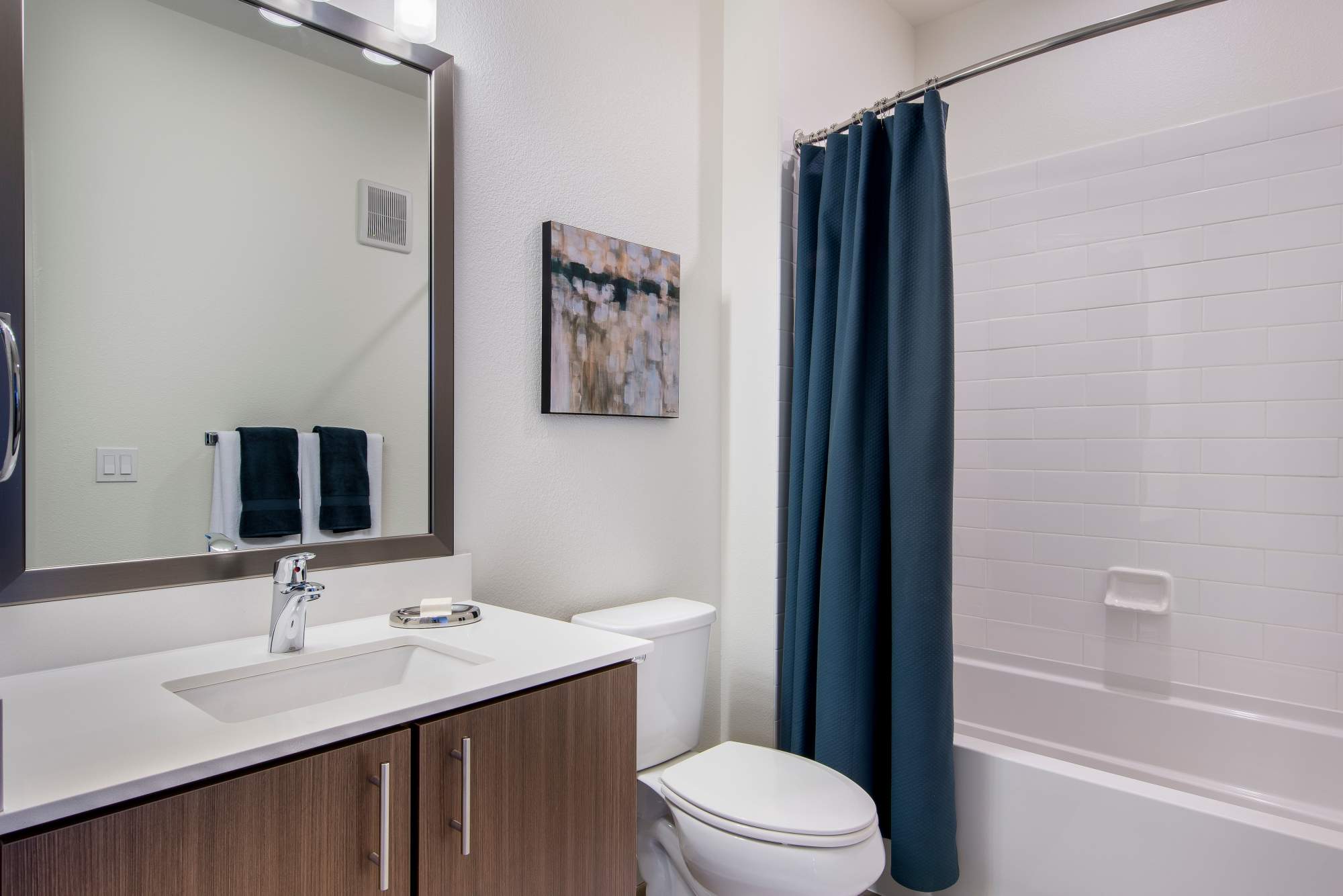 Bathroom with large mirror at Elevate in Englewood, Colorado