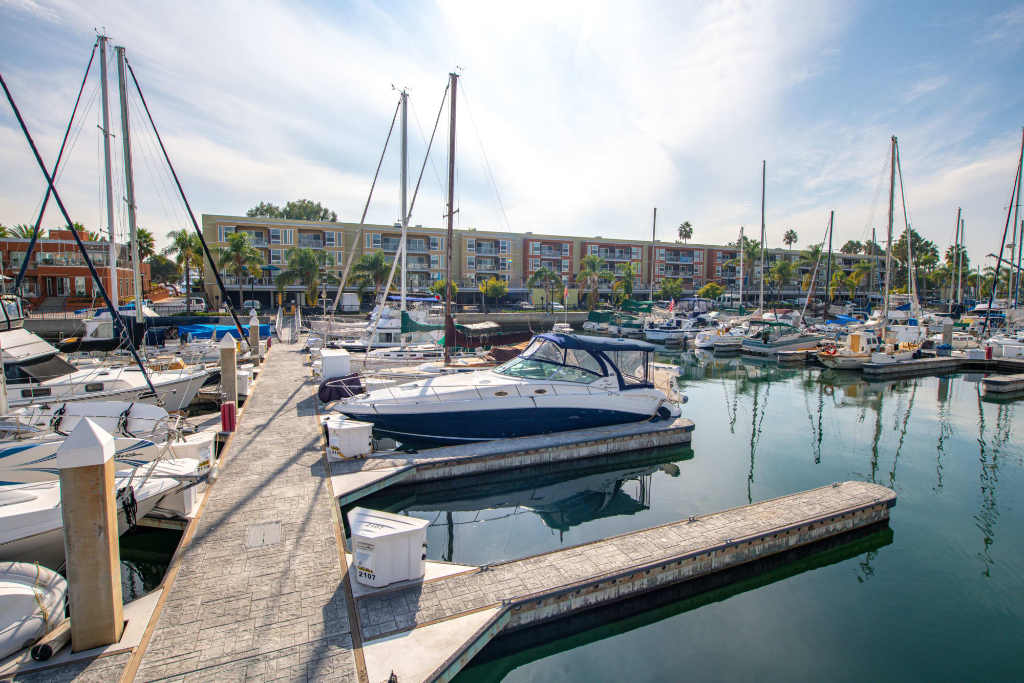 Exterior photo of Harborside Marina Bay Apartments in Marina del Rey, California, showing close proximity to the waterfront.