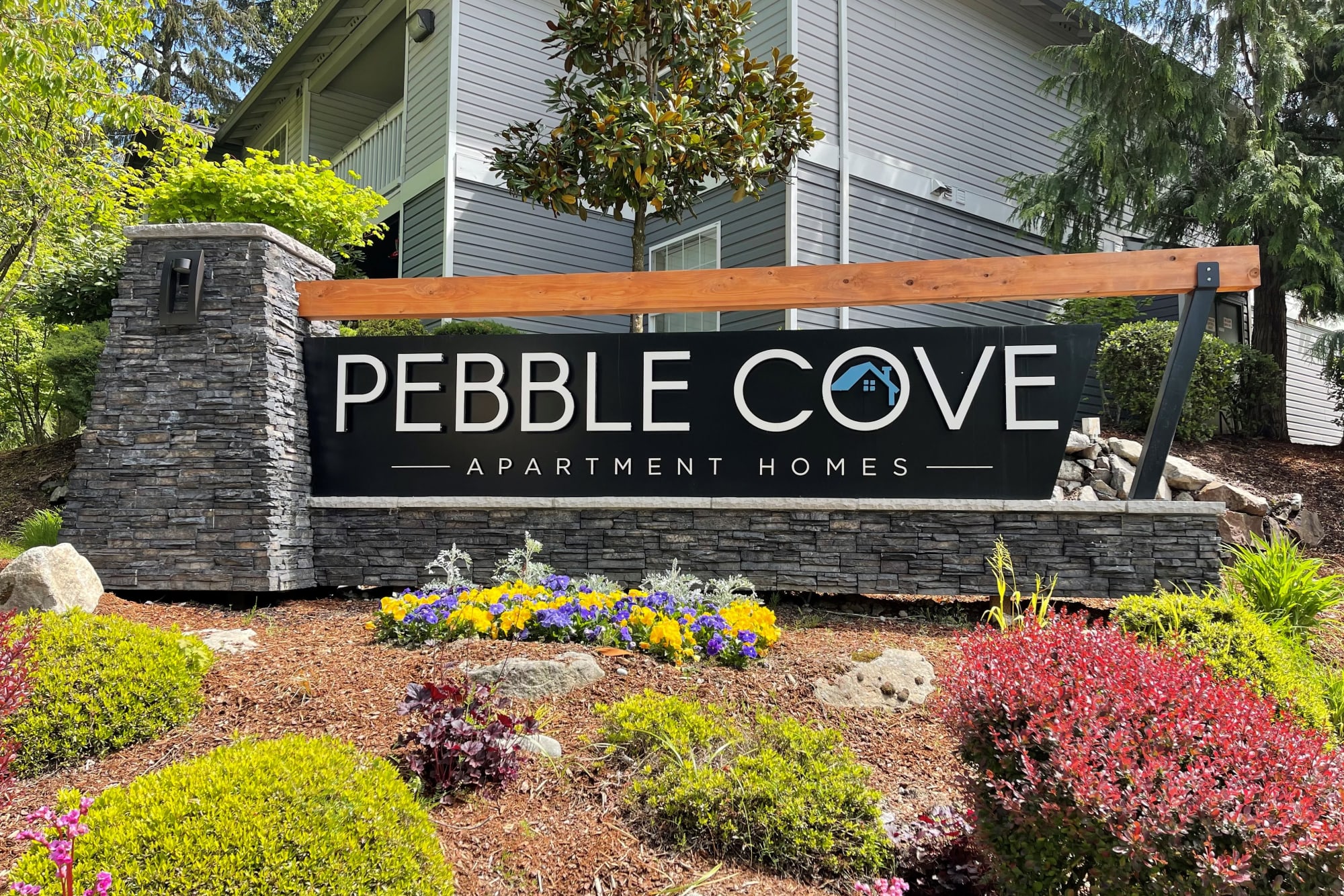 Monument sign at Pebble Cove Apartments in Renton, Washington