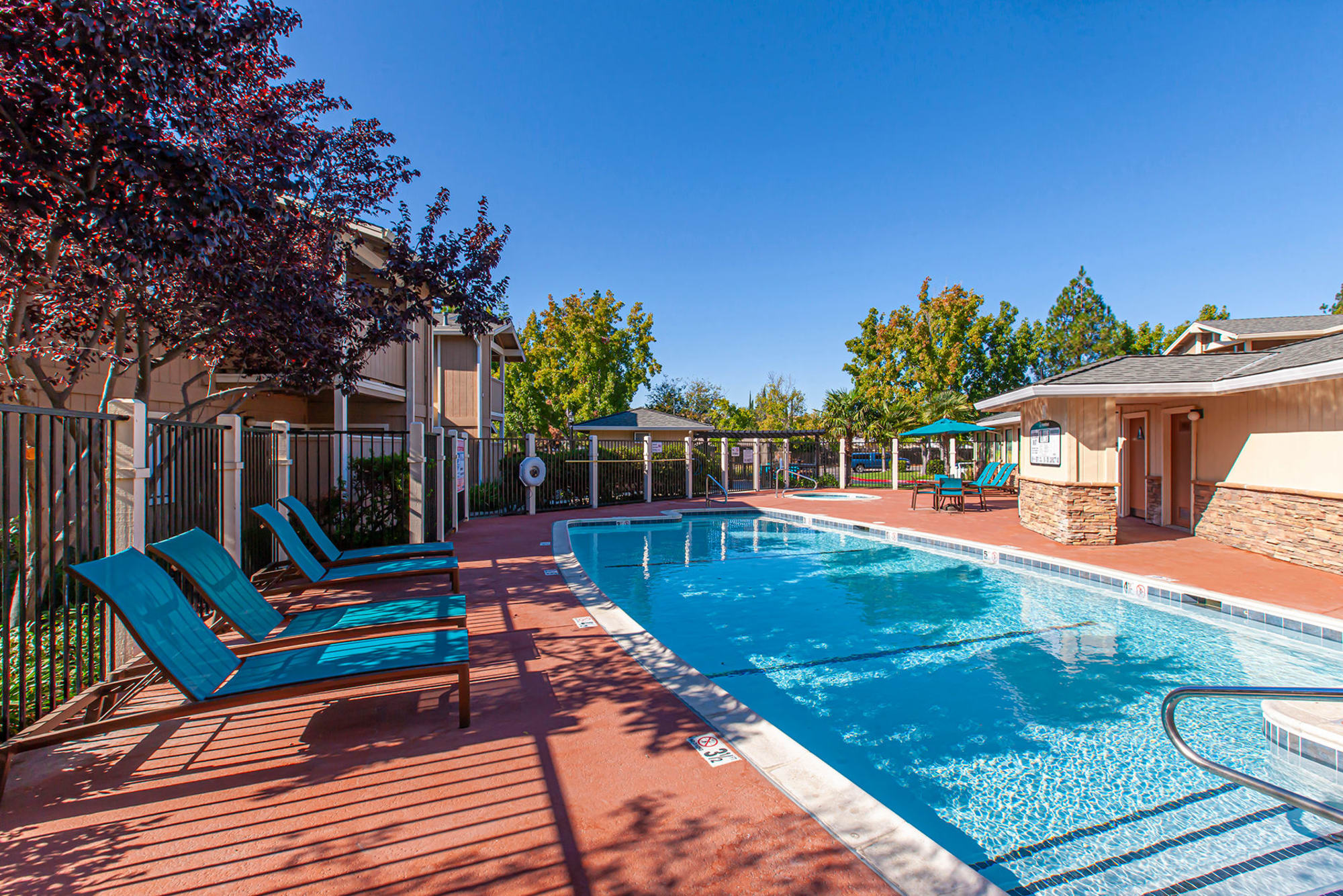 Swimming Pool with lounge Chairs at Sommerset Apartments in Vacaville, CA