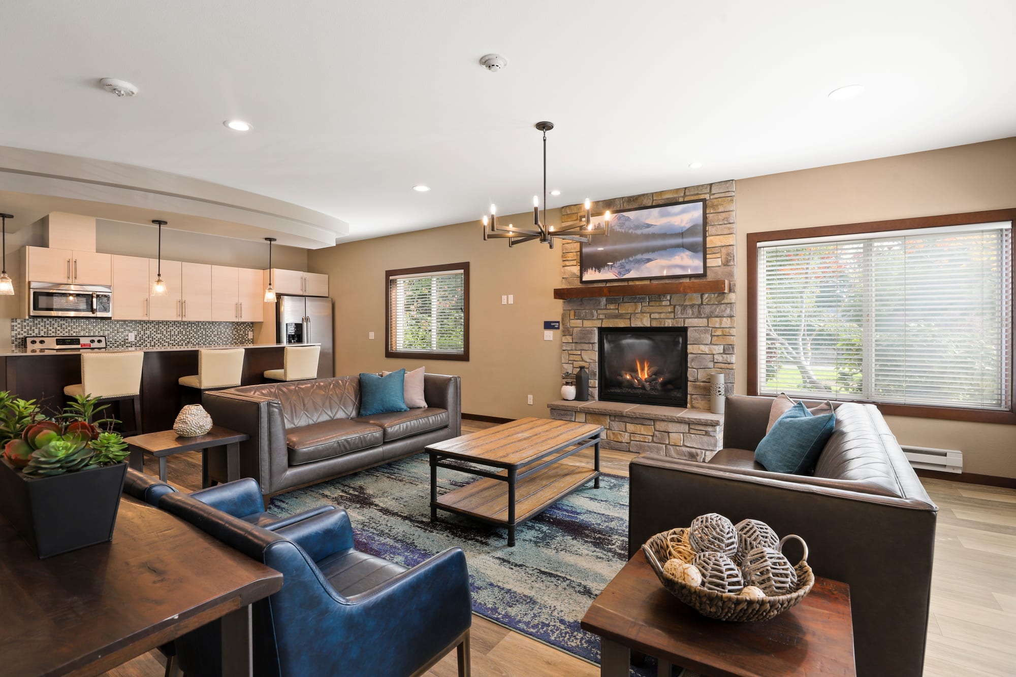 The clubhouse with plenty of seating and a flat screen television at Cascade Ridge in Silverdale, Washington