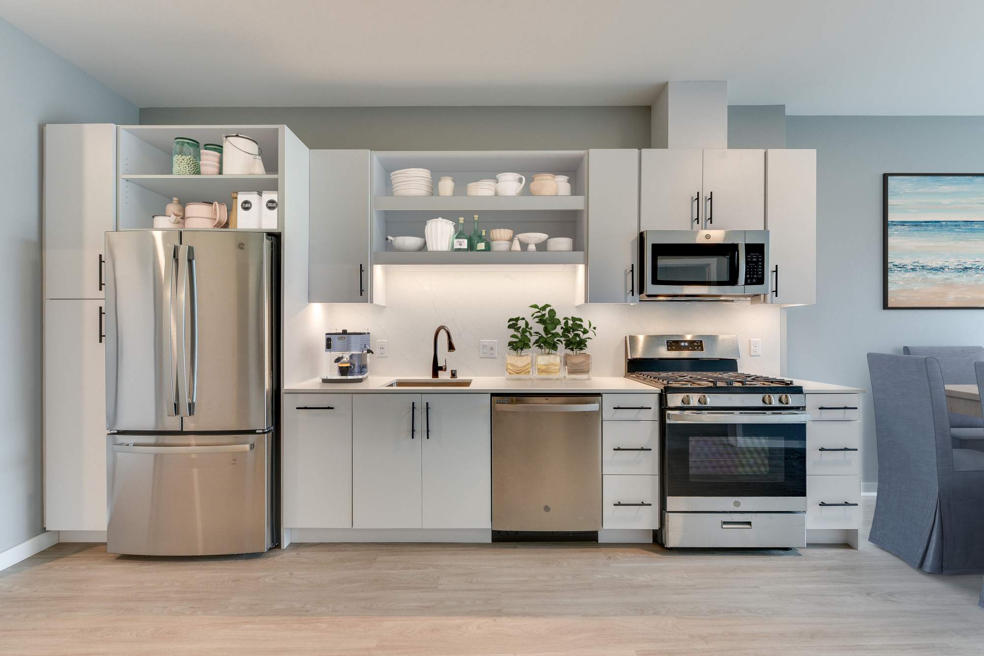 Kitchen with side by side refrigerator at The Columbia at the Waterfront in Vancouver, Washington 