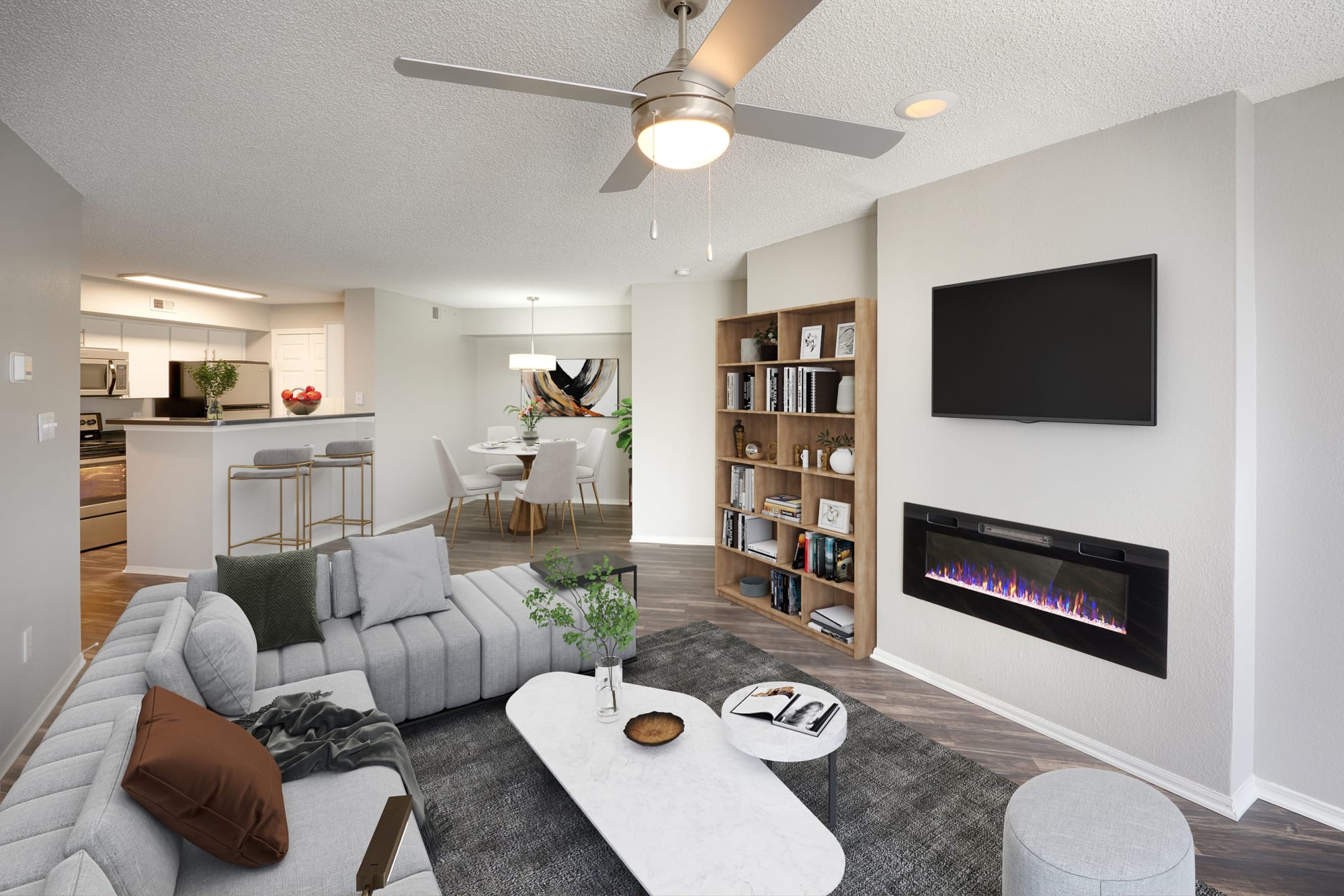 A modern living room with fireplace at Altitude Westminster in Westminster, Colorado