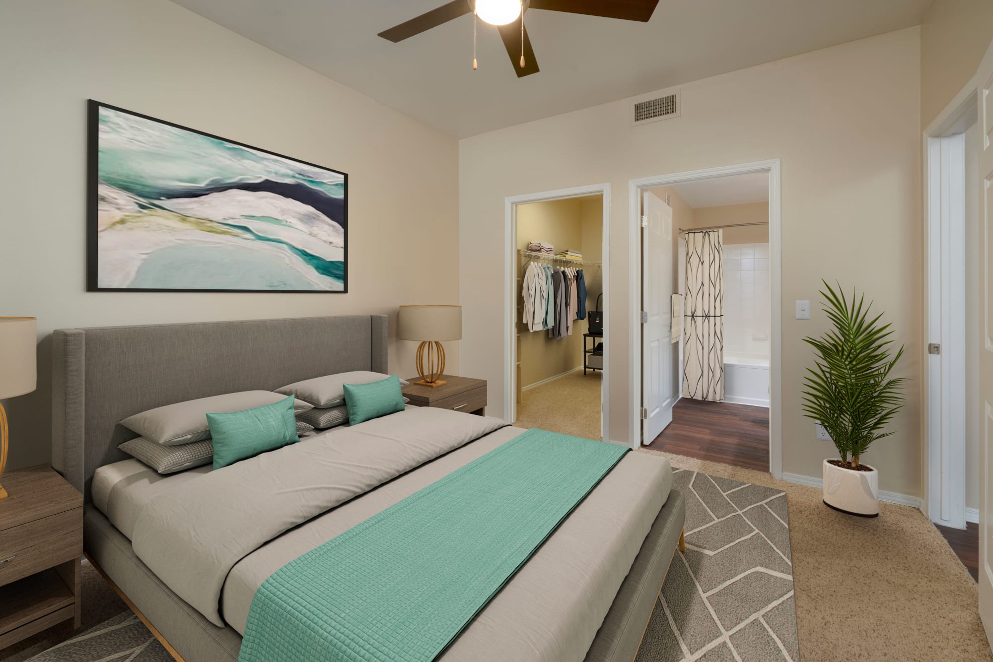 Comfortable bedroom at Promenade at Hunter's Glen Apartments in Thornton, Colorado