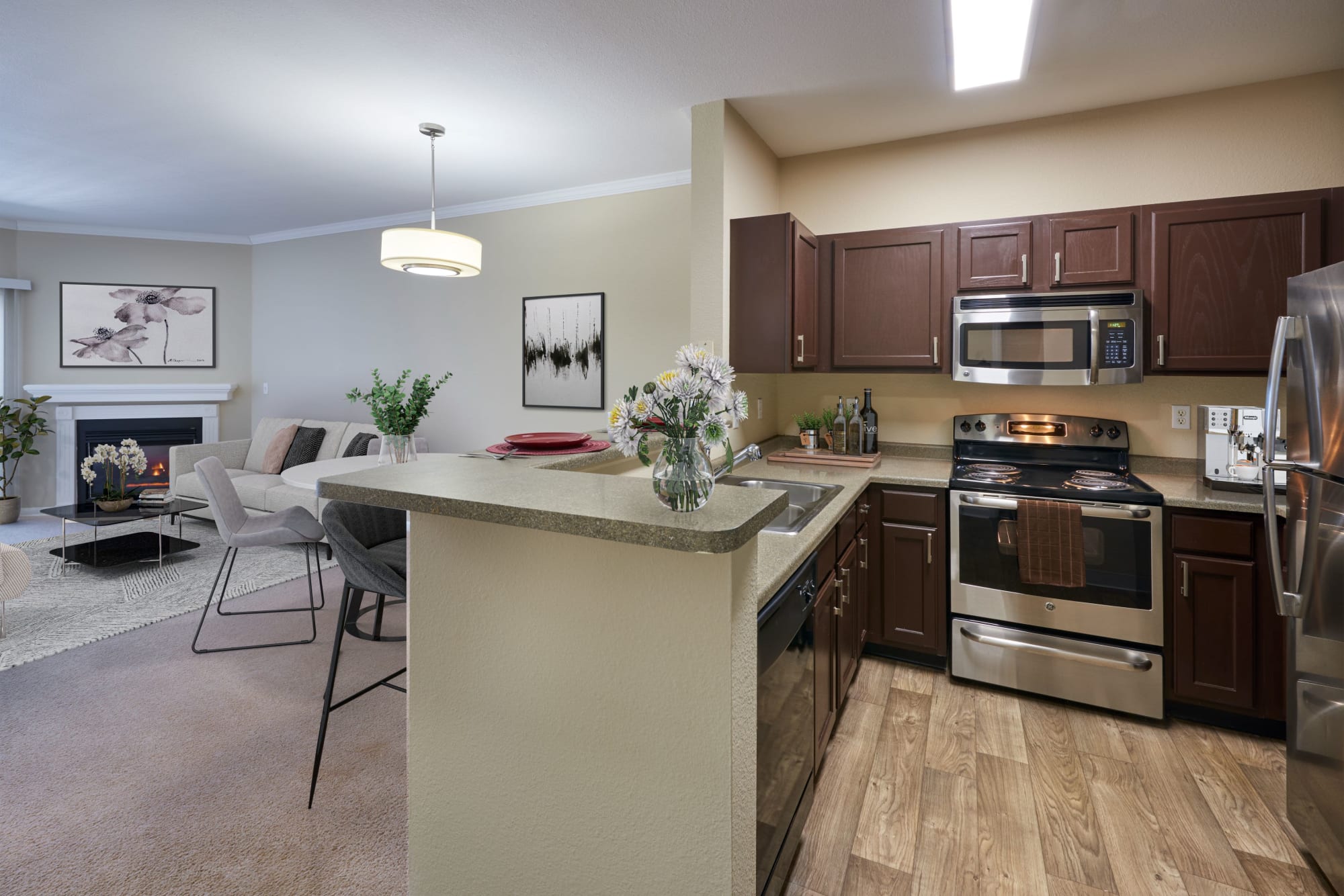 Renovated kitchen with espresso cabinets at Skyecrest Apartments in Lakewood, Colorado