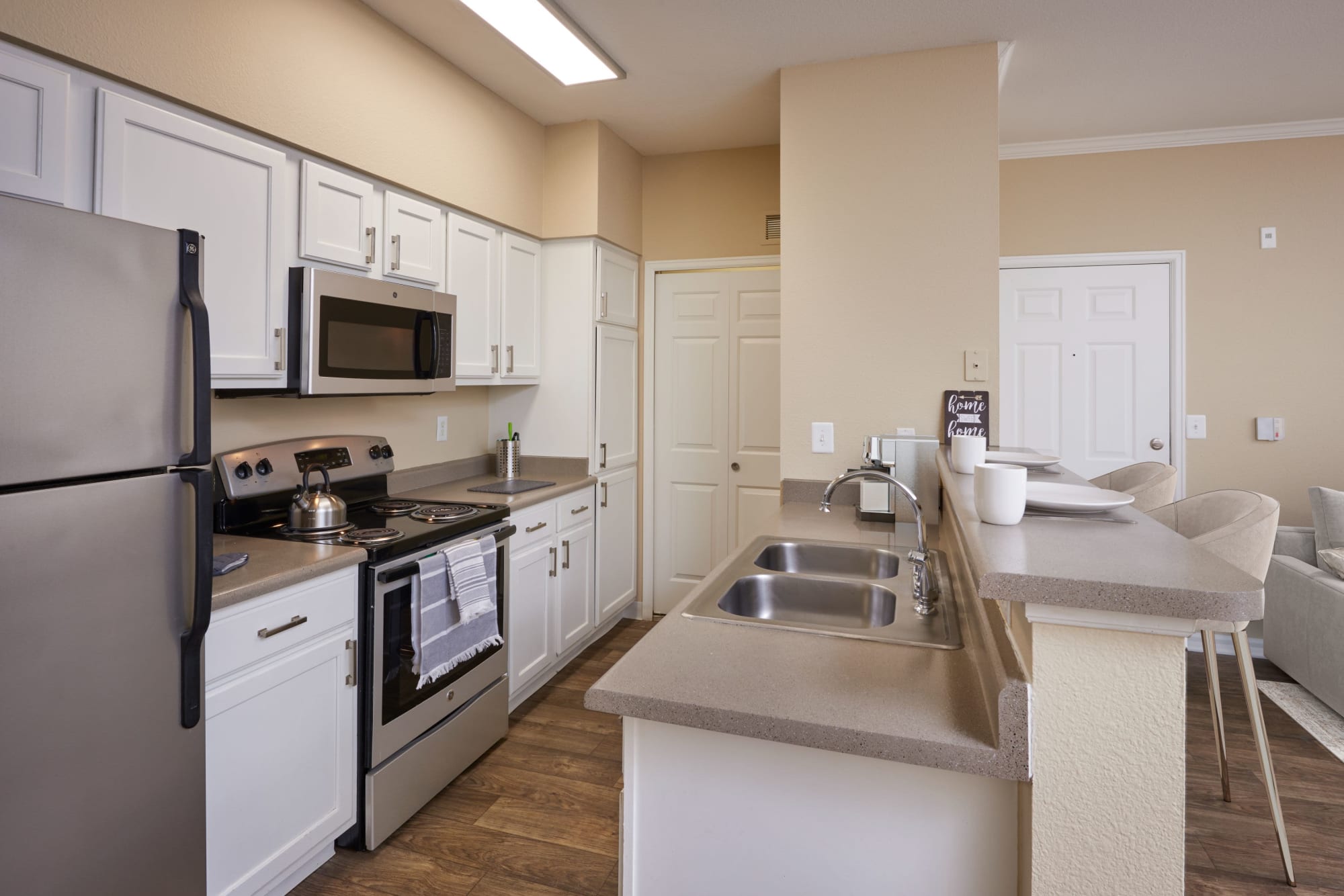Kitchen with white cabinetry at Skyecrest Apartments in Lakewood, Colorado