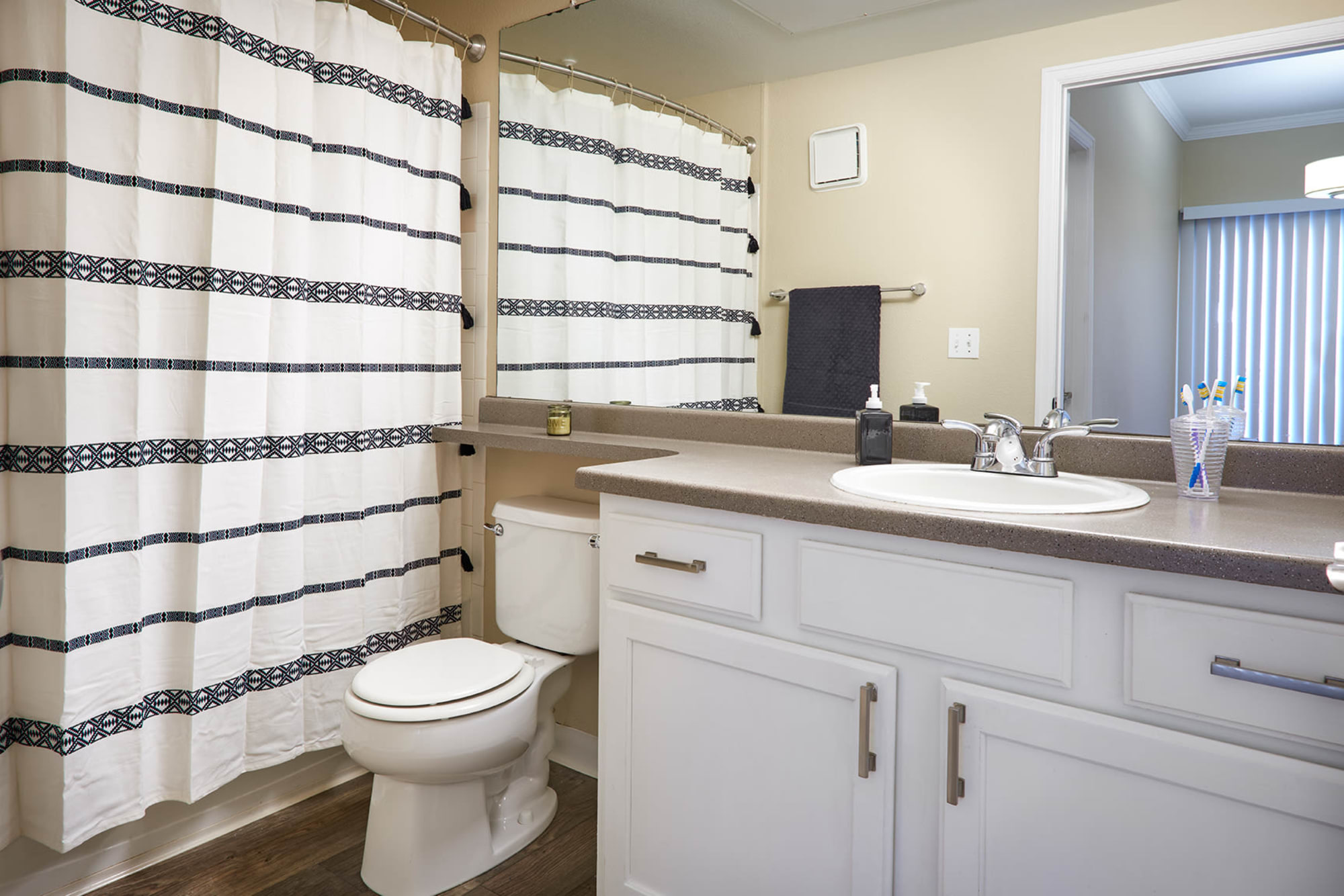 White Remodeled Bathroom at Skyecrest Apartments in Lakewood, Colorado