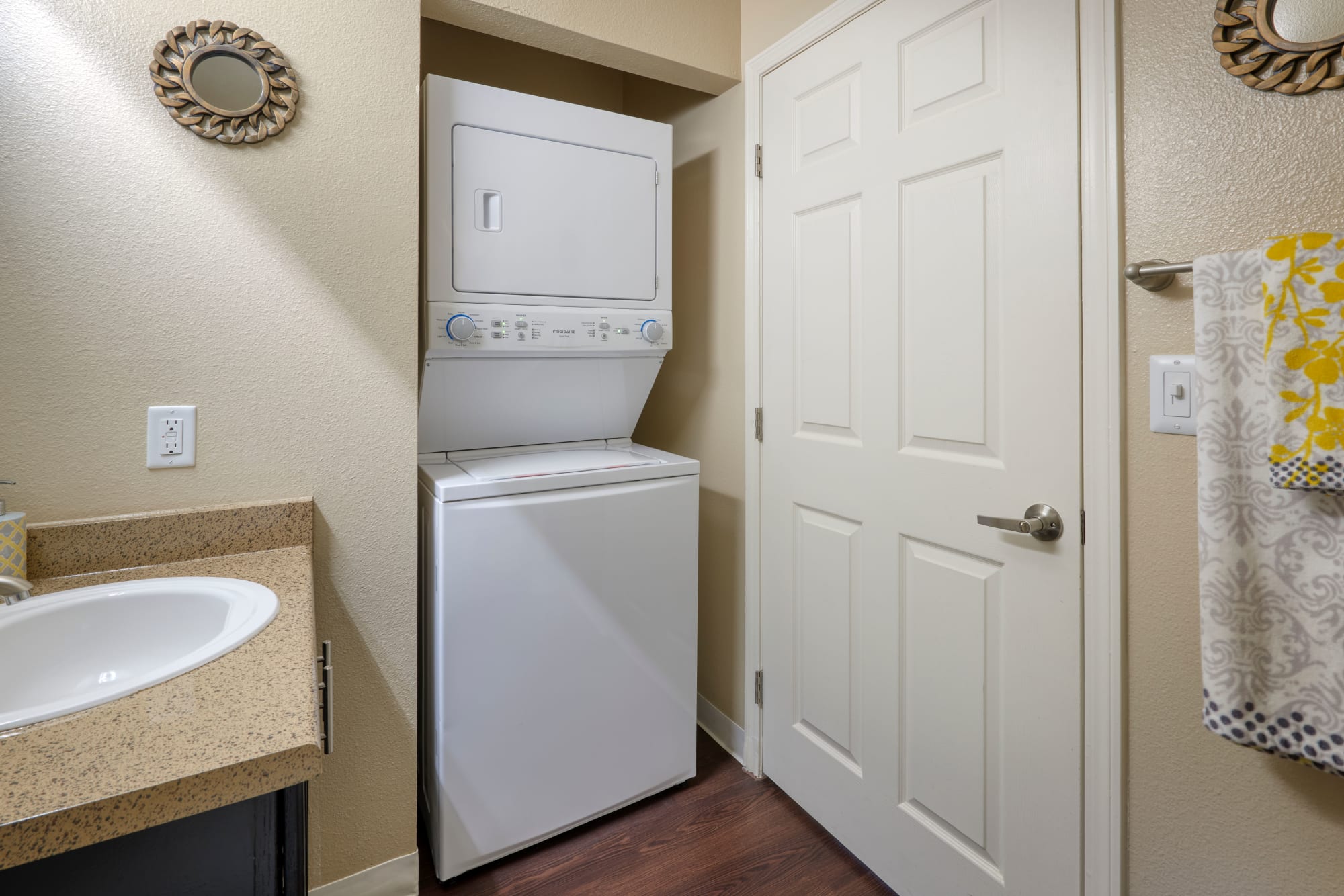 Stackable washer and dryer at Crossroads at City Center Apartments in Aurora, Colorado