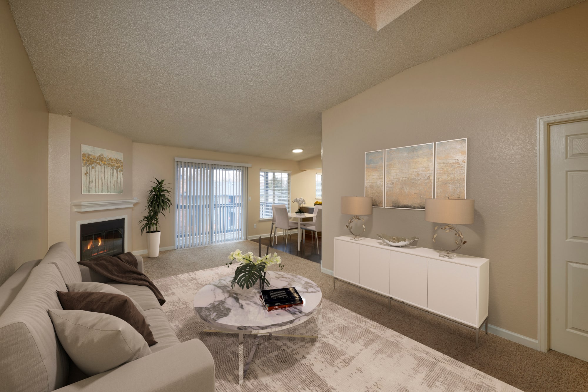 A spacious living room filled with sunlight at Arapahoe Club Apartments in Denver, Colorado