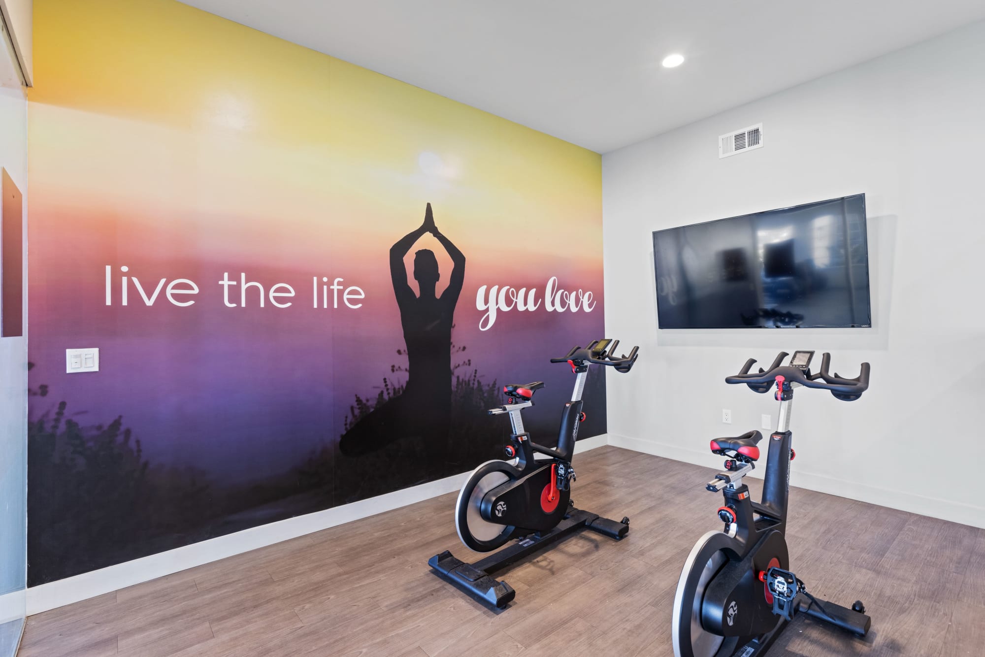 Fitness on demand room at Sierra Del Oro Apartments in Corona, California