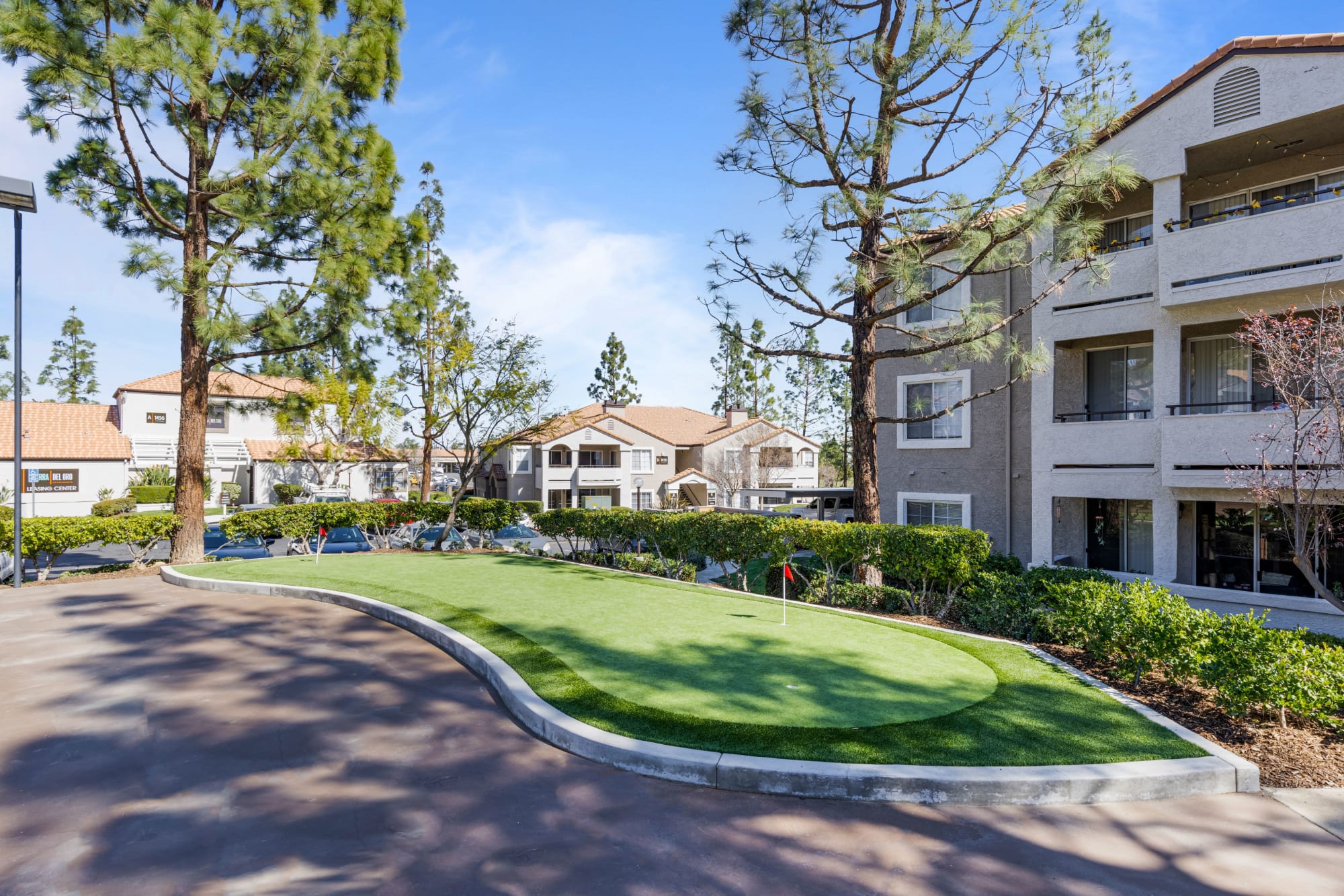 Putting green area at Sierra Del Oro Apartments in Corona, California