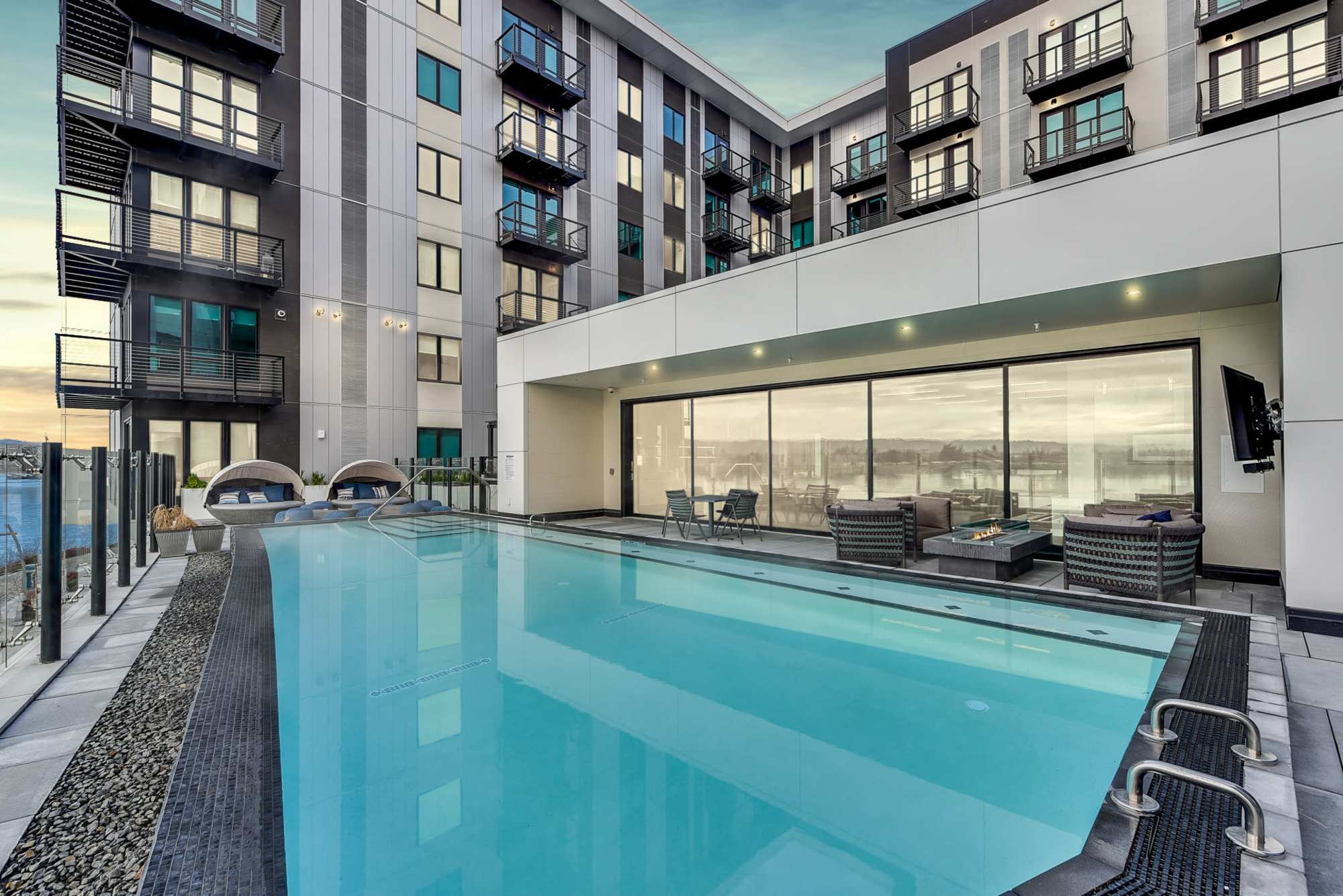 Swimming pool with firepit at The Columbia at the Waterfront in Vancouver, Washington