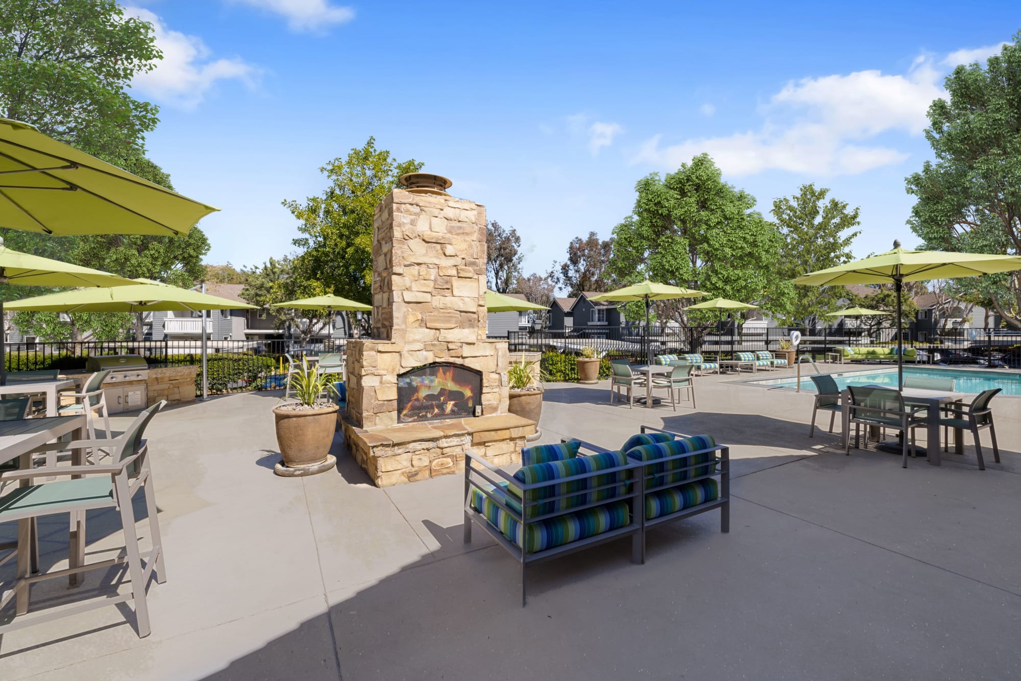 Outdoor fire pit lounge area at Village Oaks in Chino Hills, California