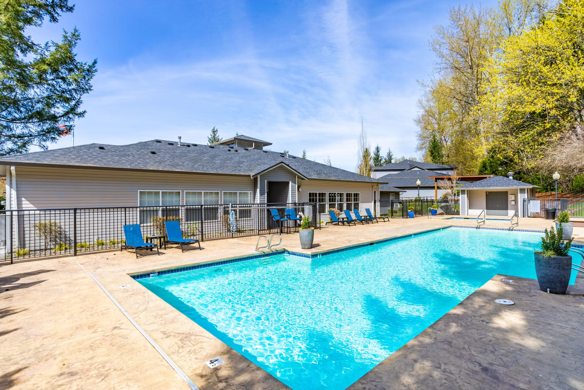 Large swimming pool at Pebble Cove Apartments in Renton, Washington