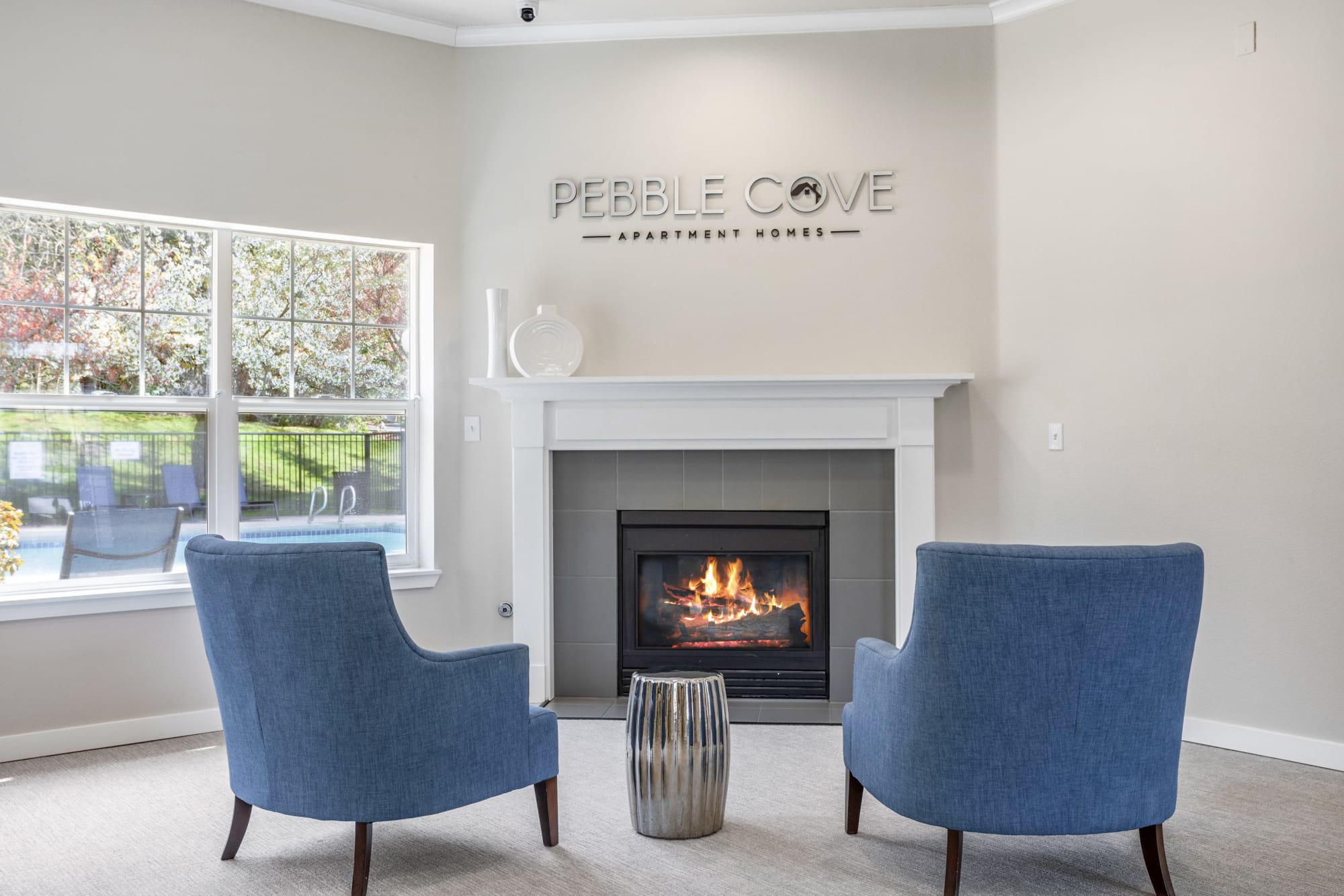 Clubhouse fireplace lounge area at Pebble Cove Apartments in Renton, Washington