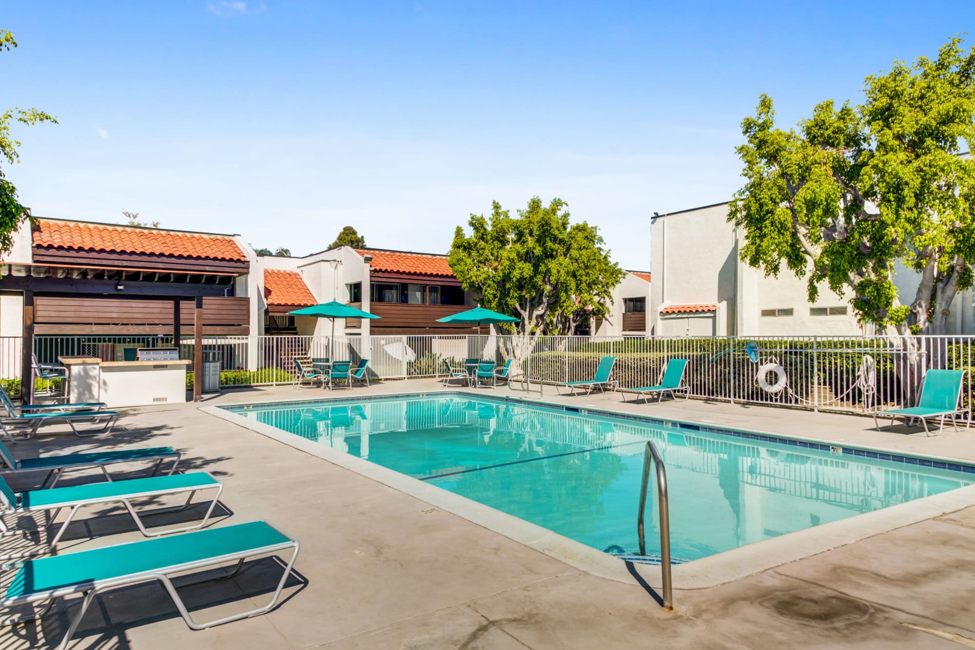 The pool, spa, cabana and barbecue area at Kendallwood Apartments in Whittier, California