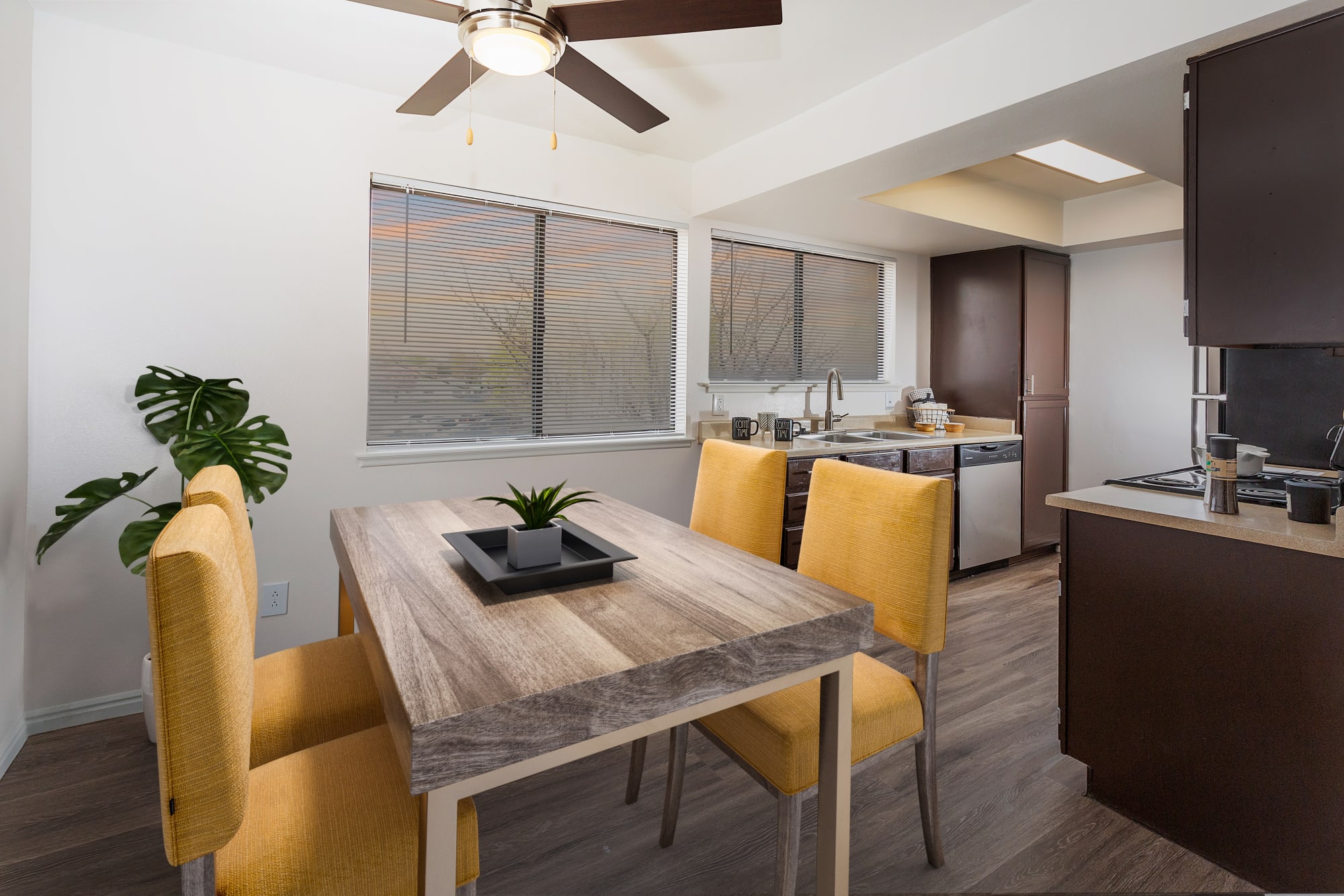 Spacious kitchen with a view into the living room at Shadowbrook Apartments in West Valley City, Utah