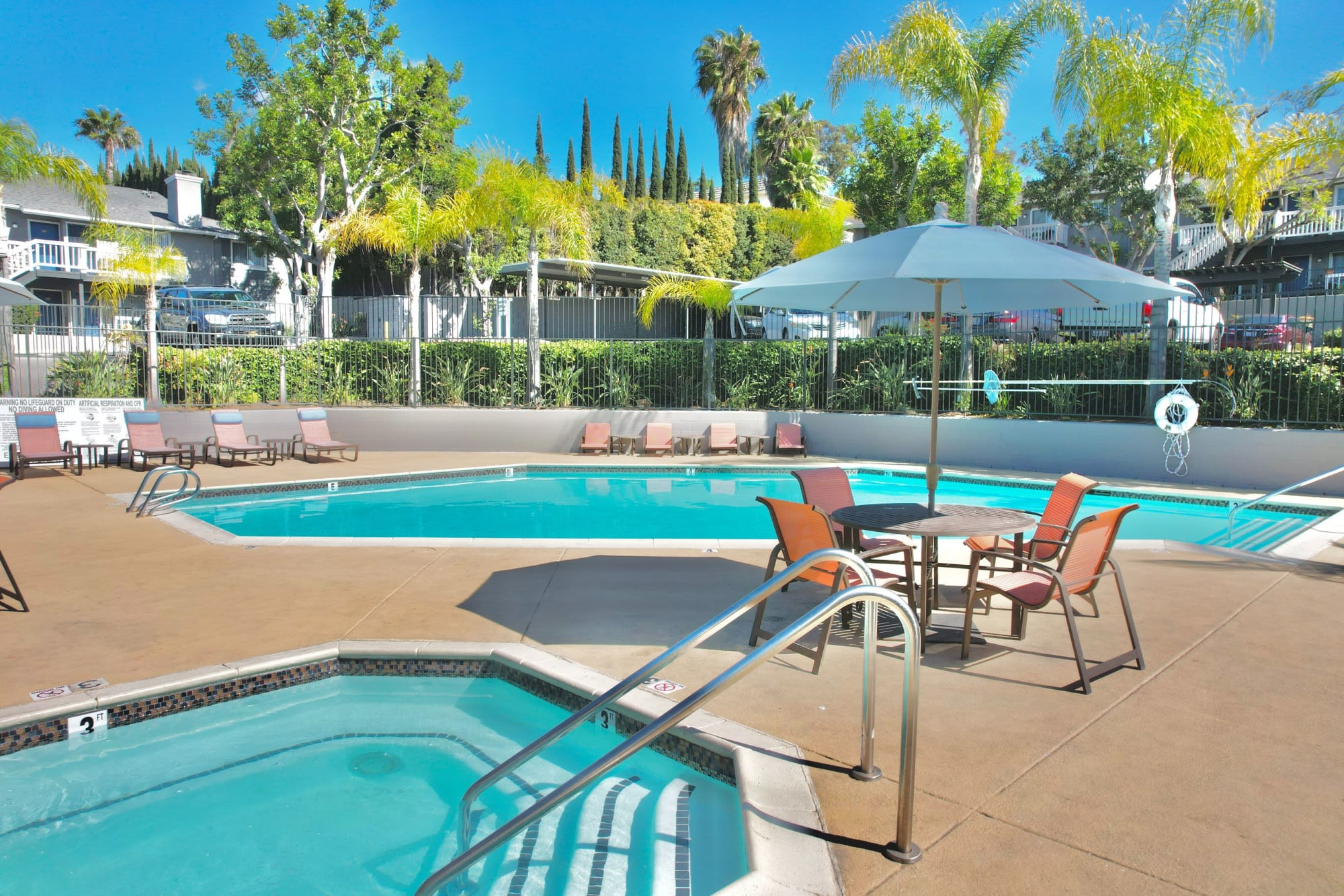The sparkling swimming pool on a sunny day at Hillside Terrace Apartments in Lemon Grove, California