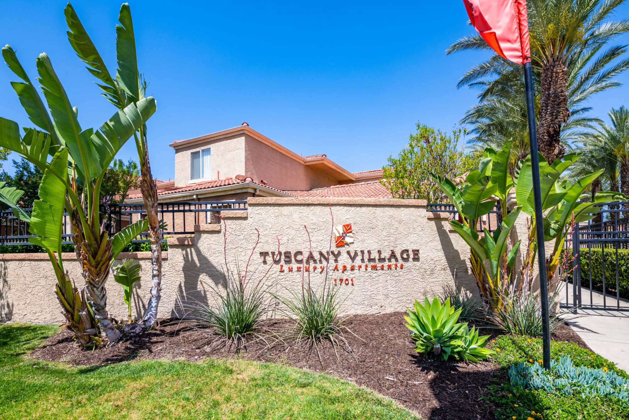 Monument sign at the entrance to the property at Tuscany Village Apartments in Ontario, California