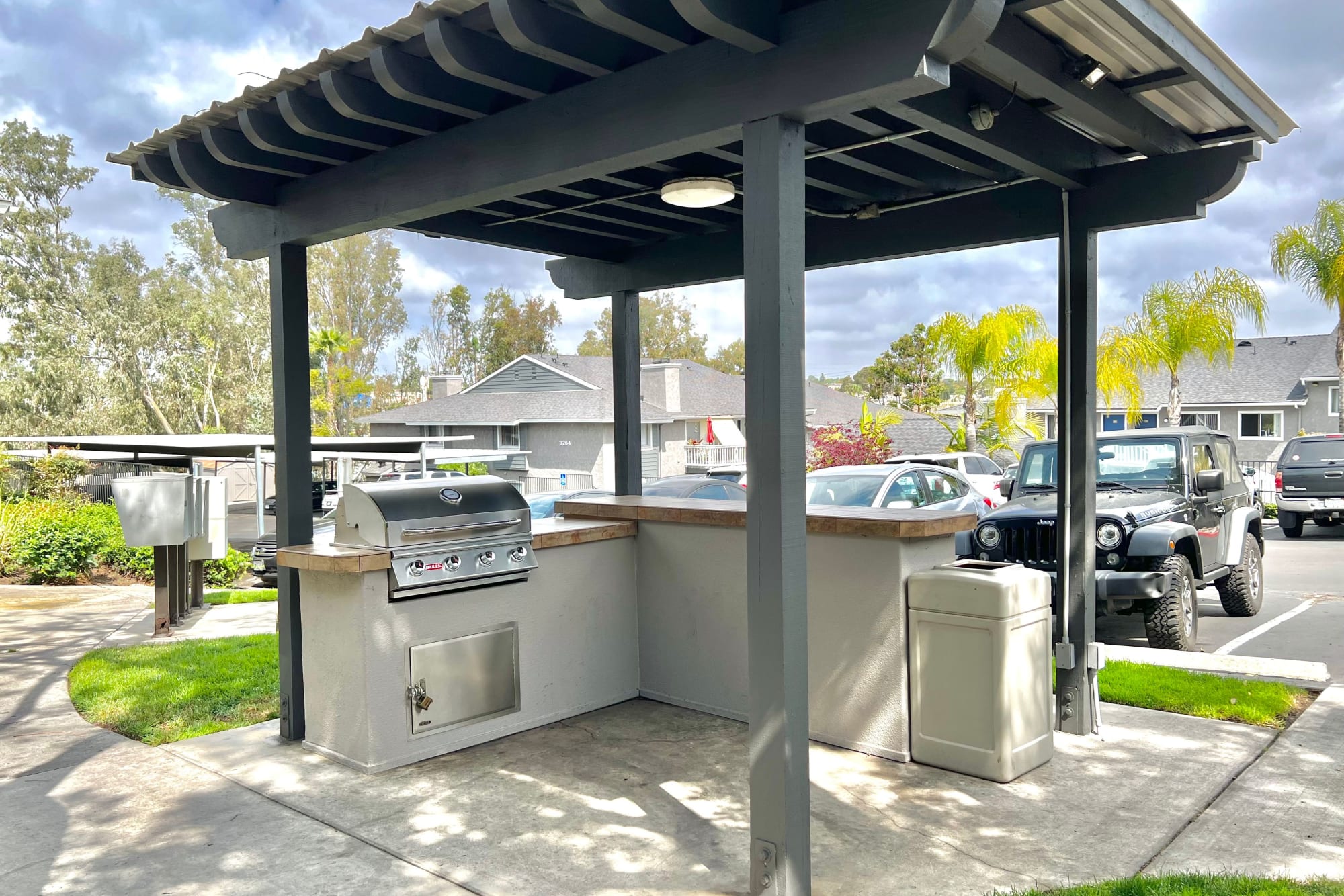 Covered outdoor BBQ area at Hillside Terrace Apartments in Lemon Grove, California