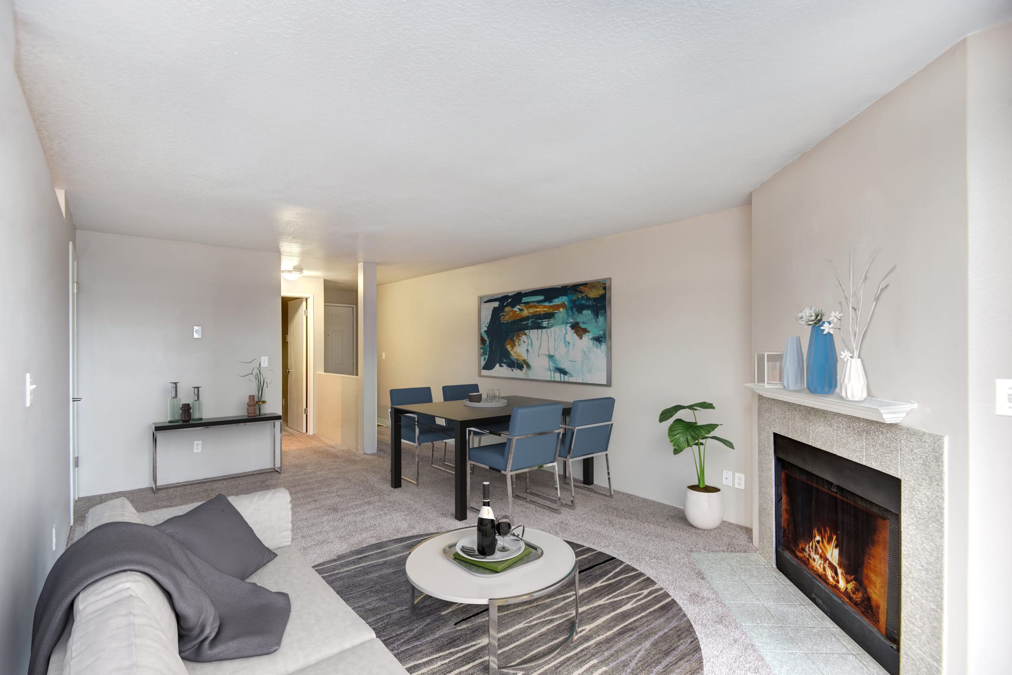 Spacious Living room complete with a fireplace at Wellington Apartment Homes in Silverdale, Washington