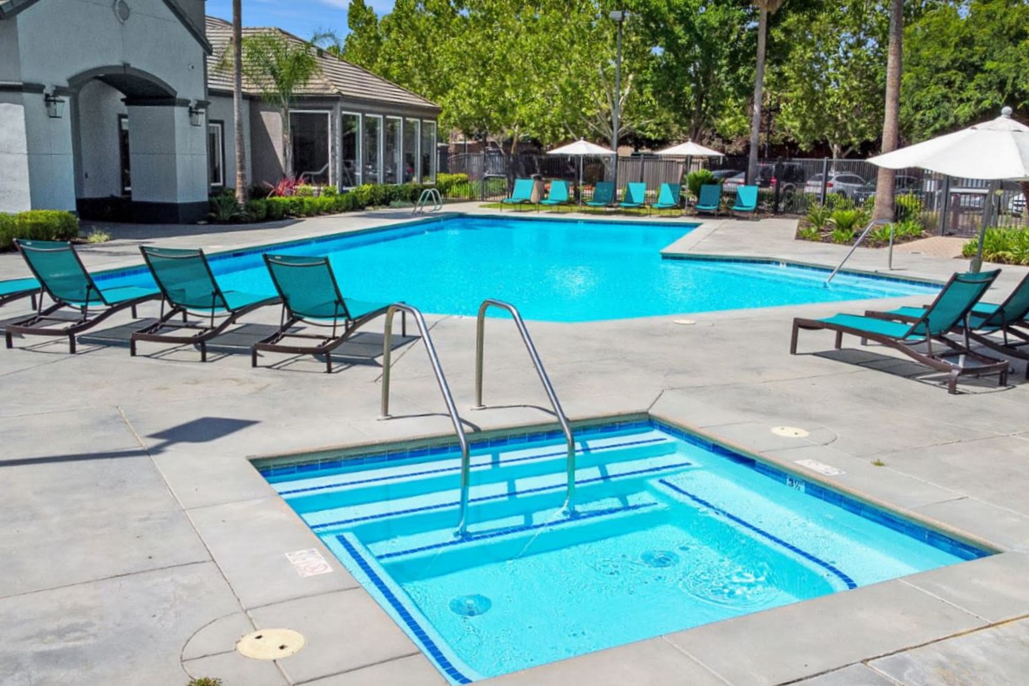 Hot tub and swimming pool at Avion Apartments in Rancho Cordova, California