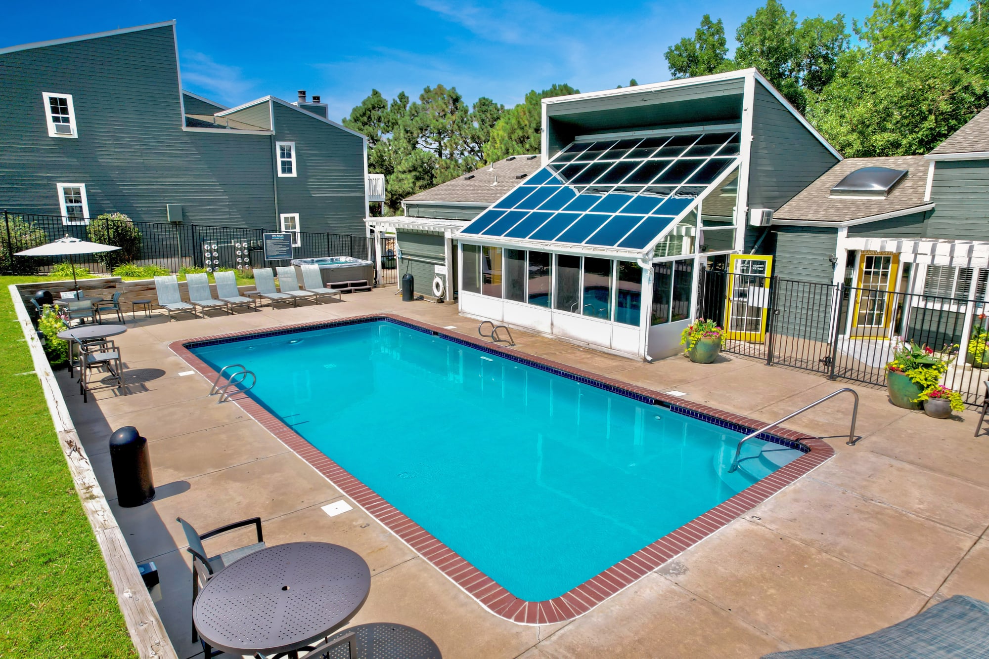 Relaxing lounge chairs by the pool at Bluesky Landing Apartments in Lakewood, Colorado