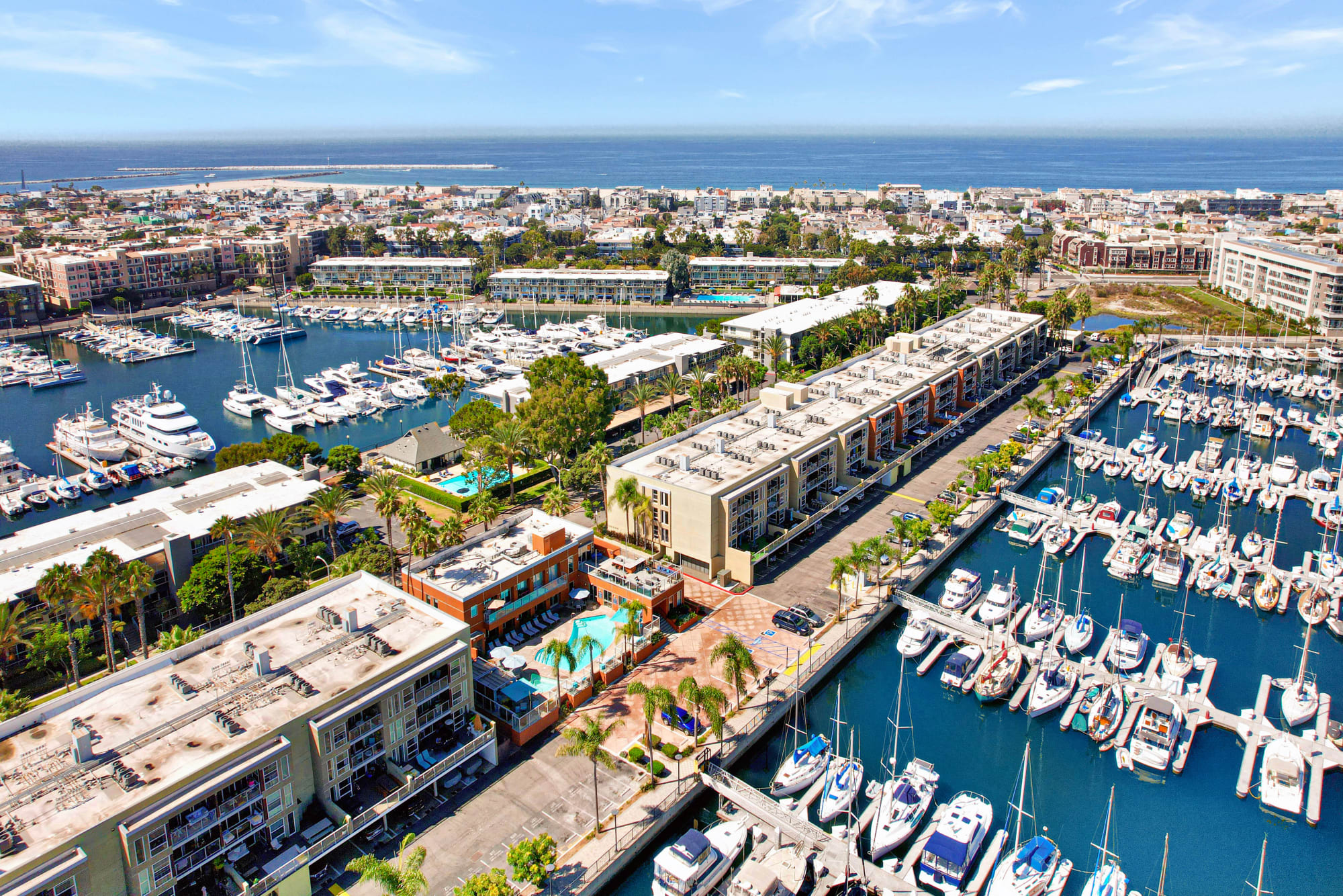 Aerial View of Property, the Marina and the Ocean at Harborside Marina Bay Apartments in Marina del Rey, California