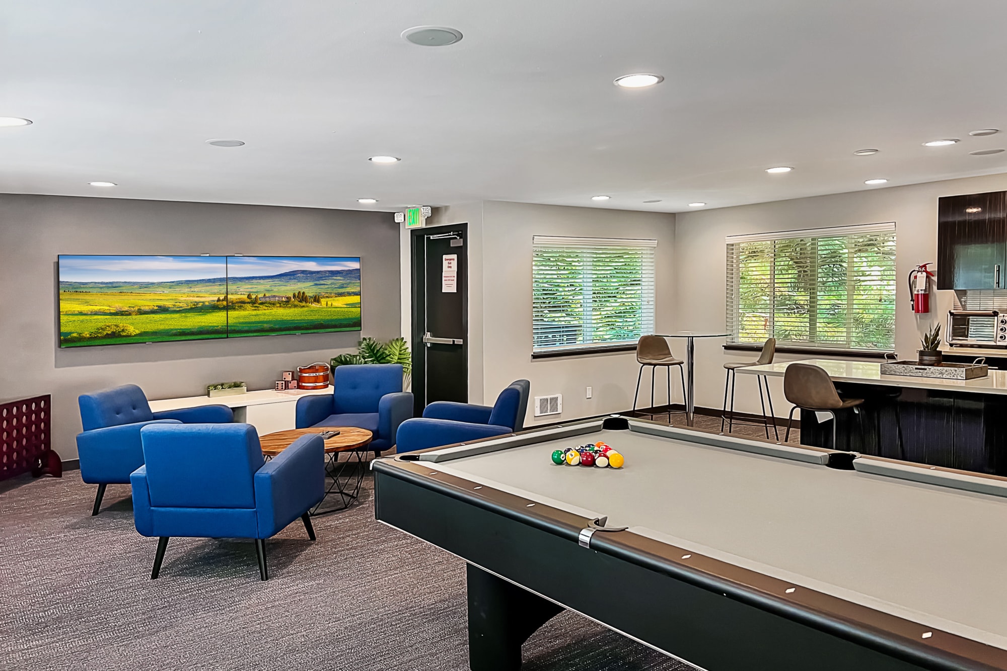 Game room with a pool table at Karbon Apartments in Newcastle, Washington