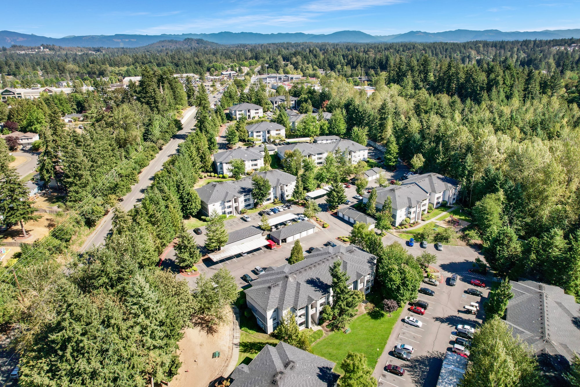 Aerial view of the property and surrounding area at Pebble Cove Apartments in Renton, Washington