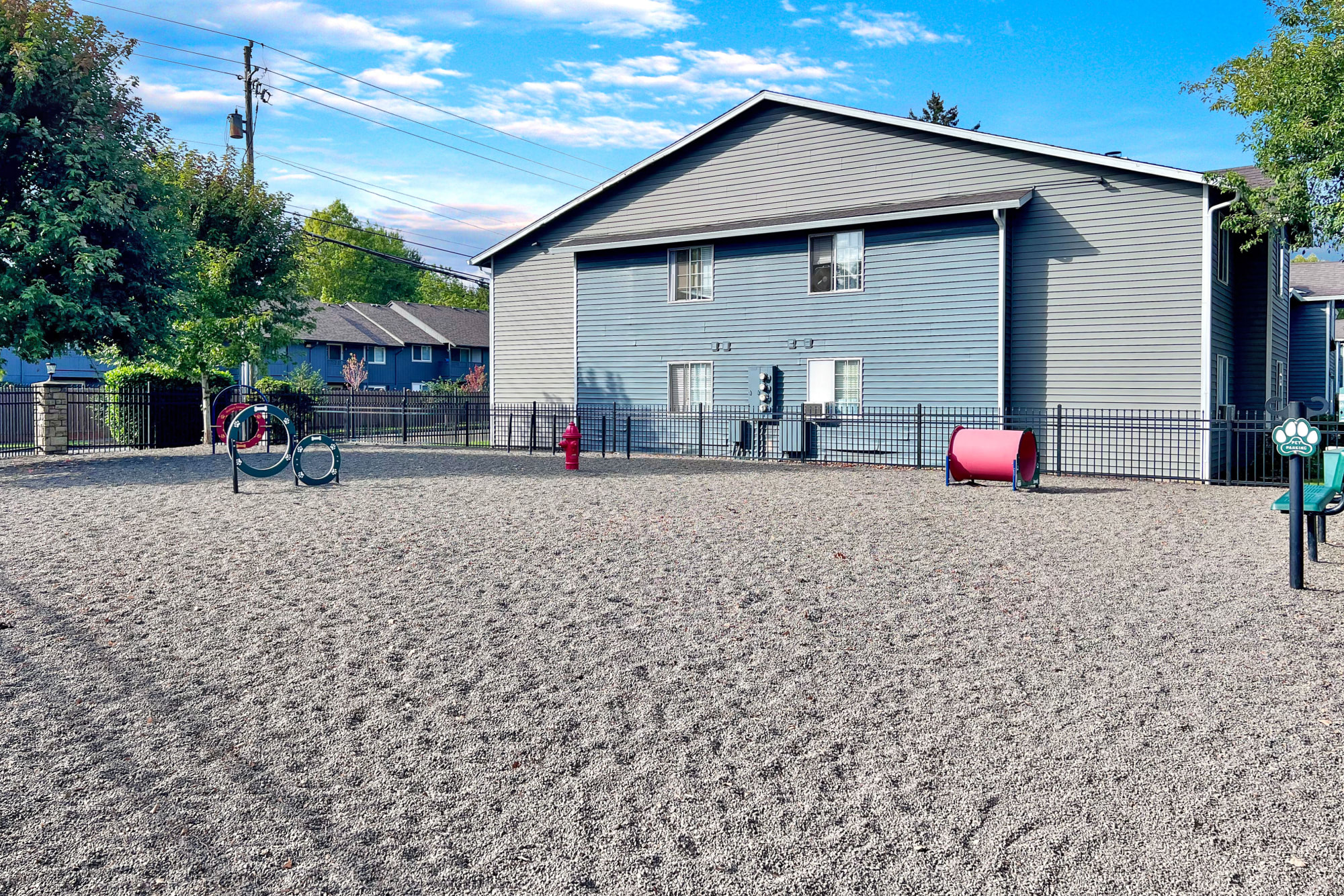 Onsite off-leash dog park with toys at Walnut Grove Landing Apartments in Vancouver, Washington