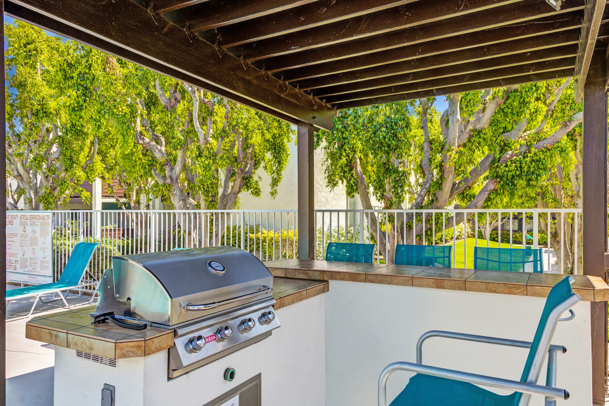 Poolside covered BBQ area at Kendallwood Apartments in Whittier, California