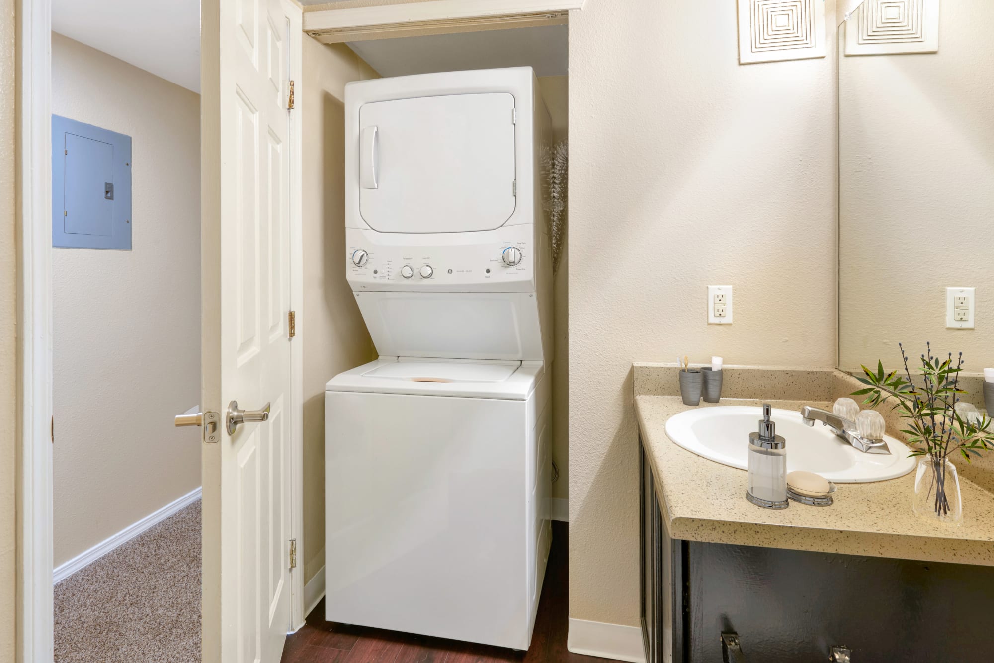 Stackable washer and dryer at Crossroads at City Center Apartments in Aurora, Colorado