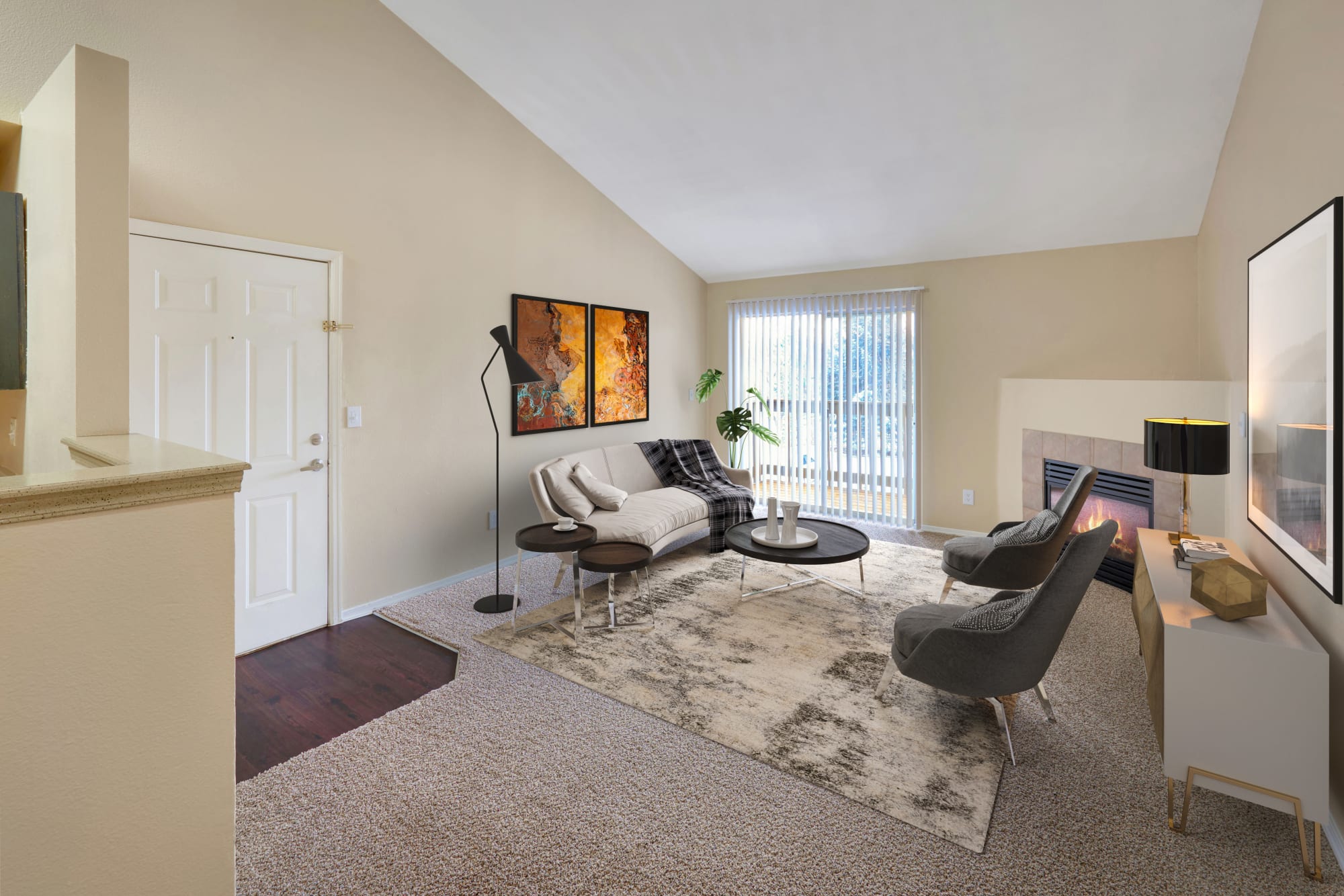 Living room with a fireplace at Crossroads at City Center Apartments in Aurora, Colorado