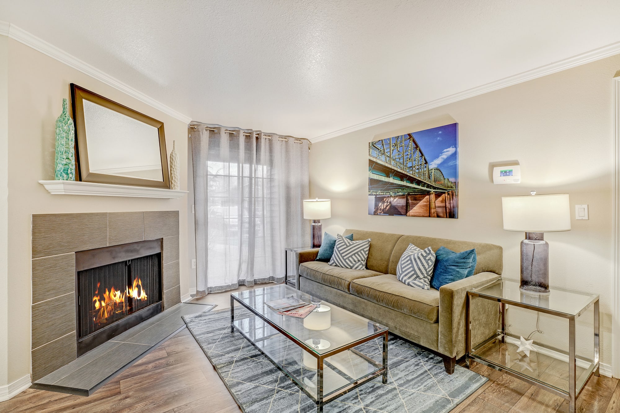 Living room with a fireplace at Walnut Grove Landing Apartments in Vancouver, Washington