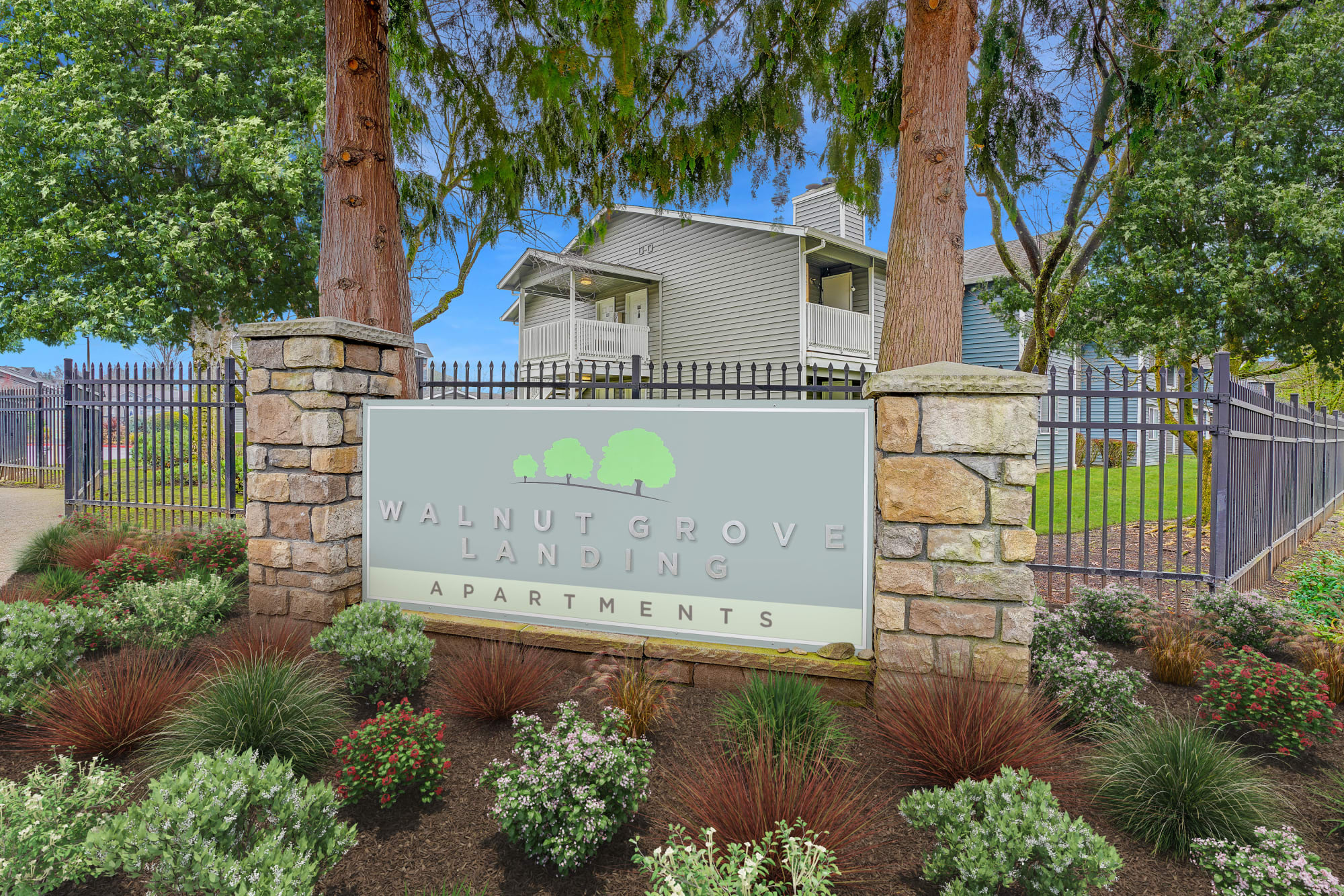 Monument sign at the entryway of Walnut Grove Landing Apartments in Vancouver, Washington