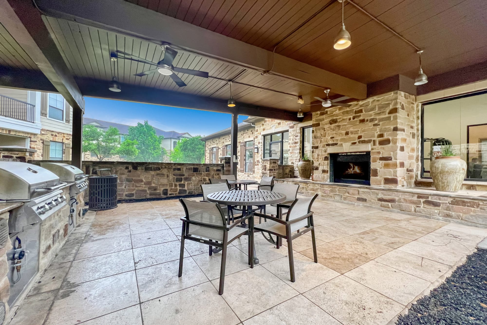 The covered outdoor BBQ and Fireplace at Broadstone Grand Avenue in Pflugerville, Texas
