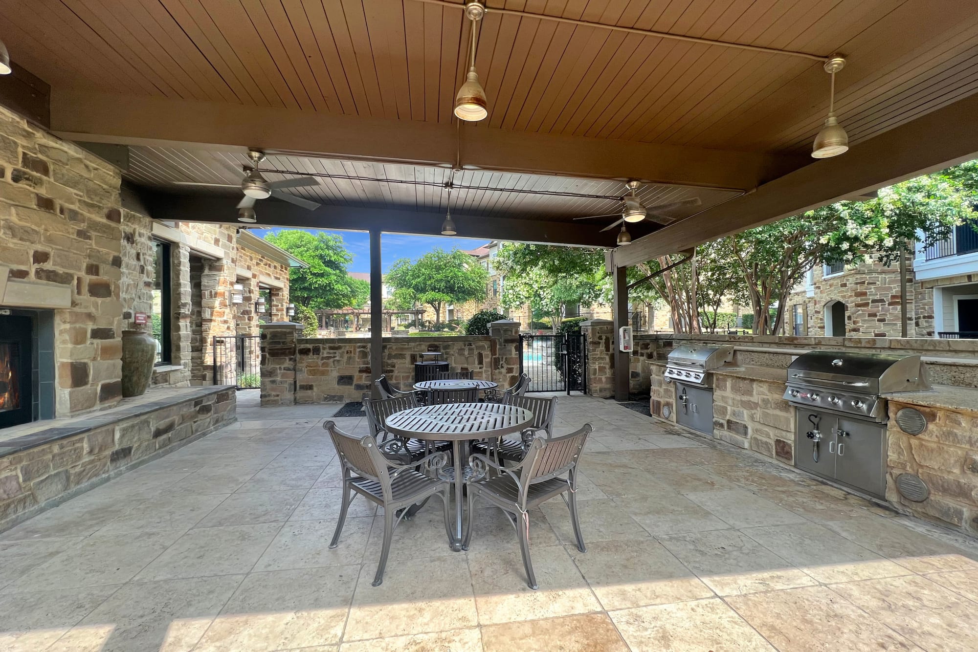 The covered outdoor BBQ and Fireplace at Broadstone Grand Avenue in Pflugerville, Texas