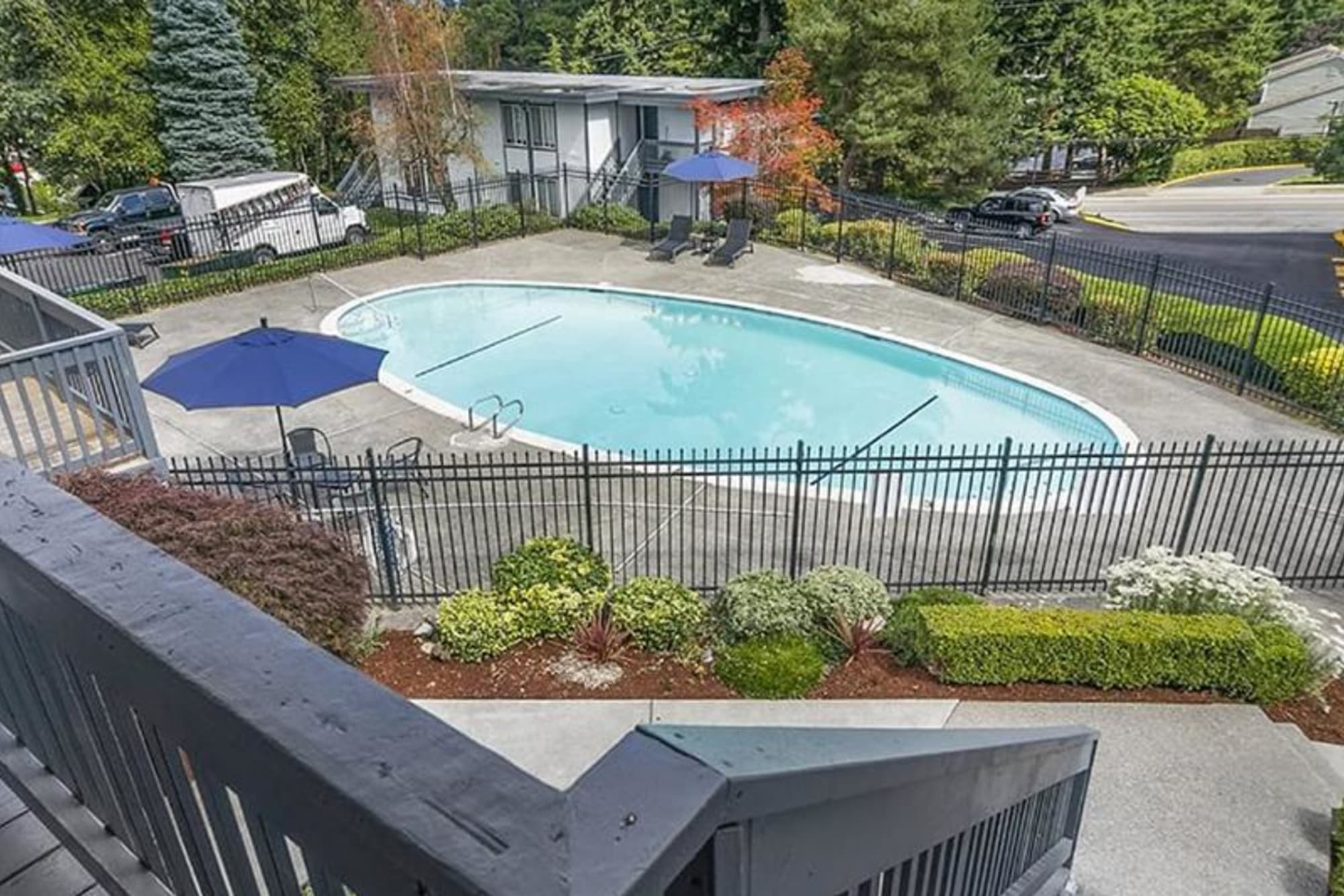 A view to our swimming pool from one of our apartment homes at Capri in Mountlake Terrace, Washington