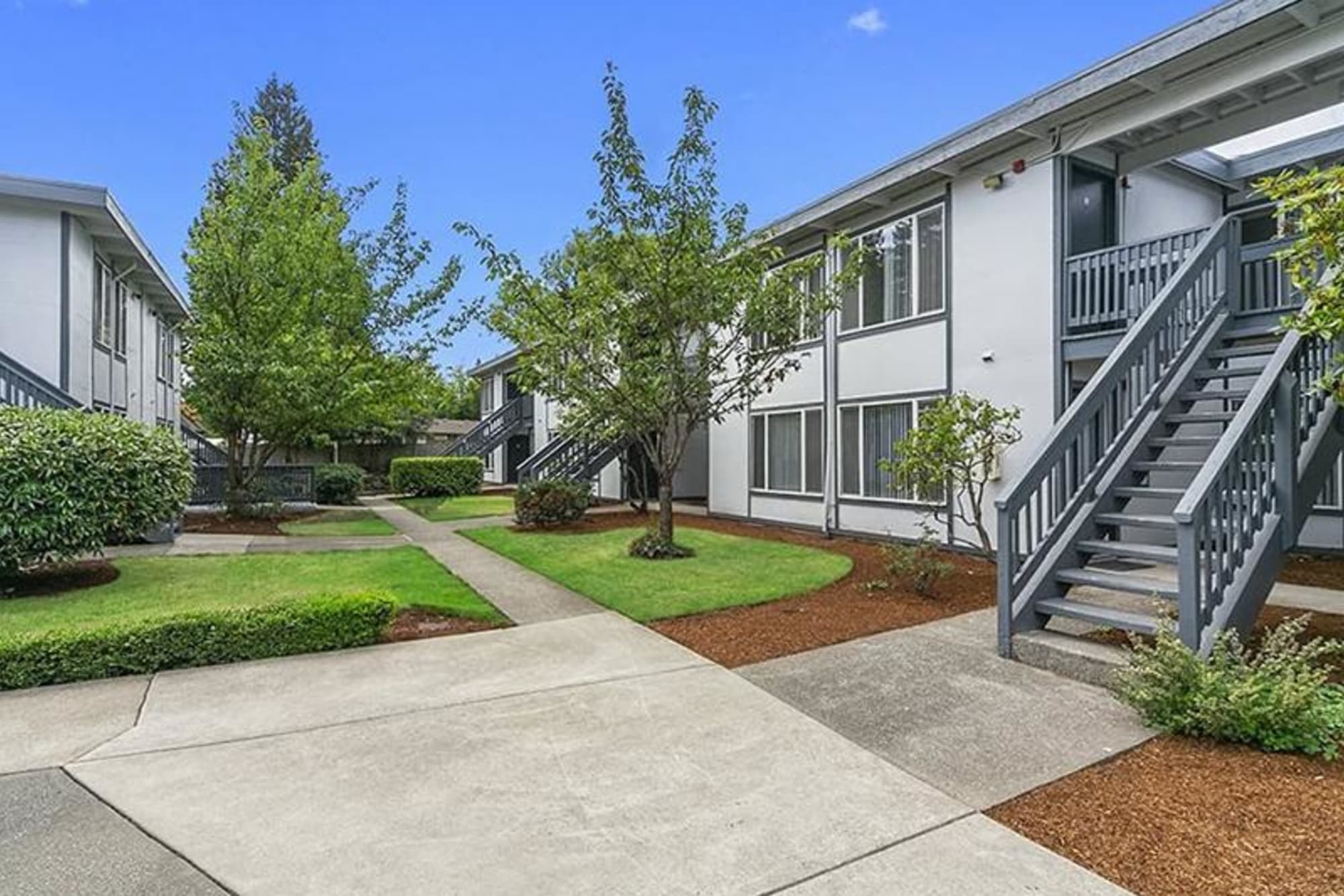 Exterior view of walkway to our apartment homes at Capri in Mountlake Terrace, Washington