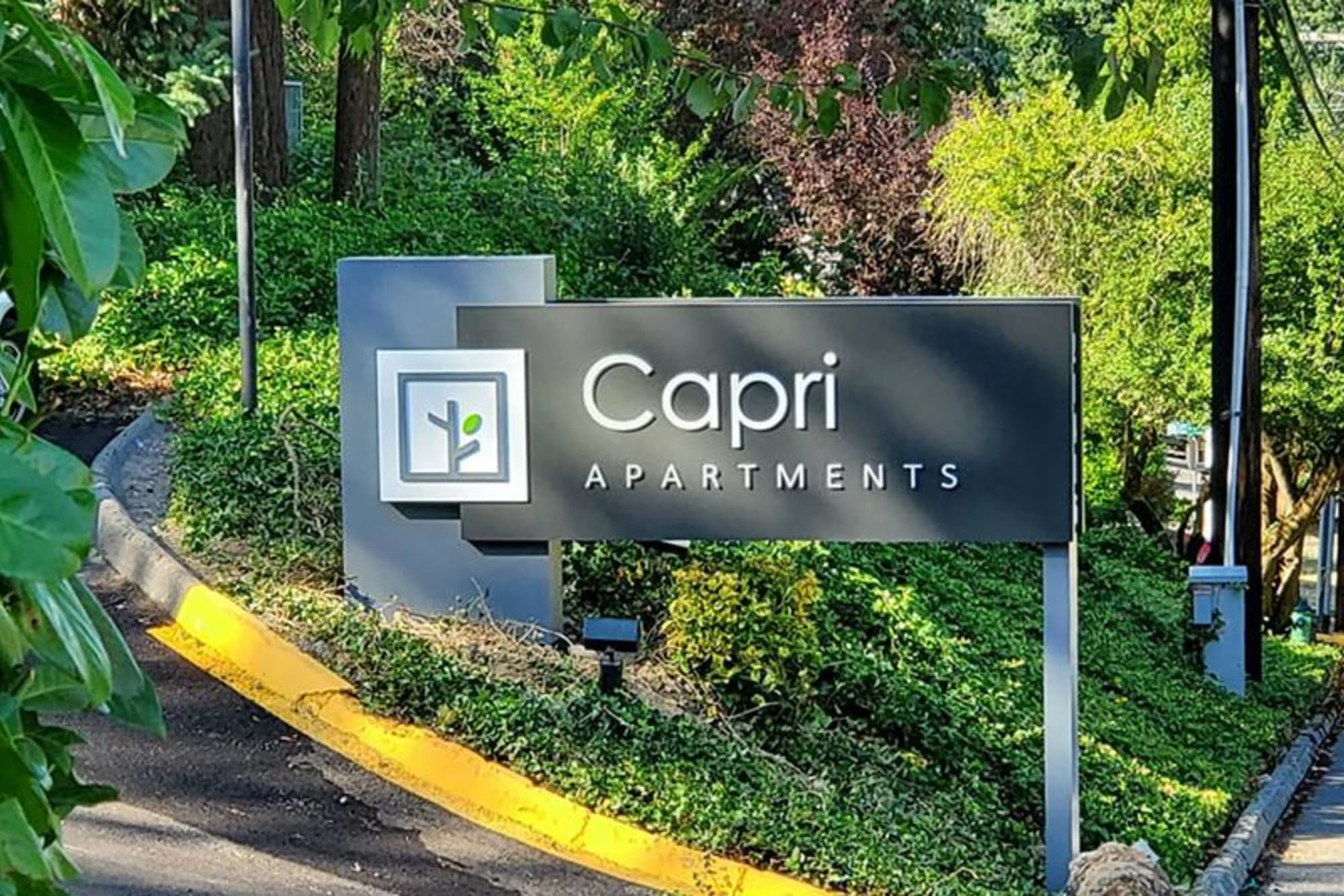 Welcome sign to our apartments at Capri in Mountlake Terrace, Washington