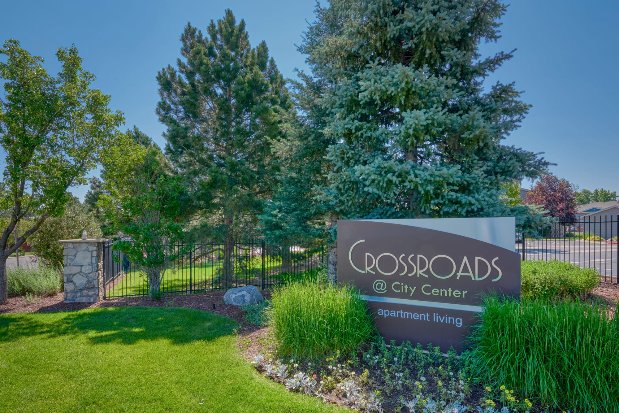 The monument sign at Crossroads at City Center Apartments in Aurora, Colorado