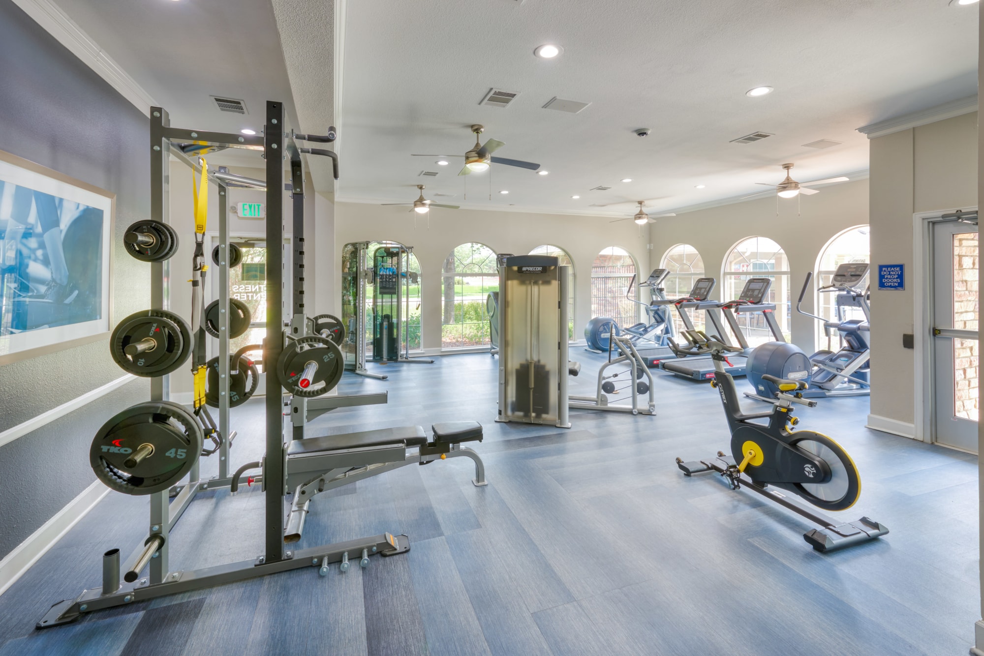Fitness center entryway and weights at Gateway Park Apartments in Denver, Colorado