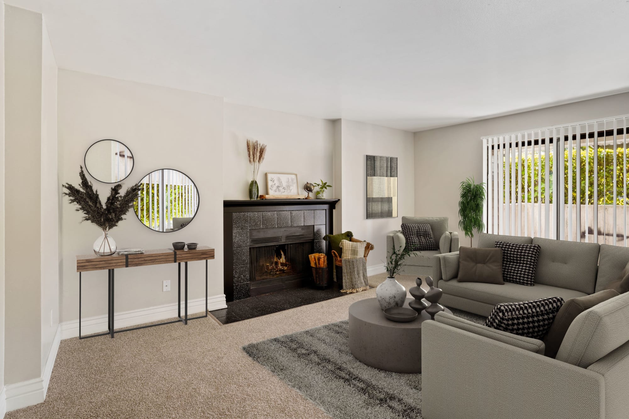 Furnished model living room with a fireplace at Royal Ridge Apartments in Midvale, Utah