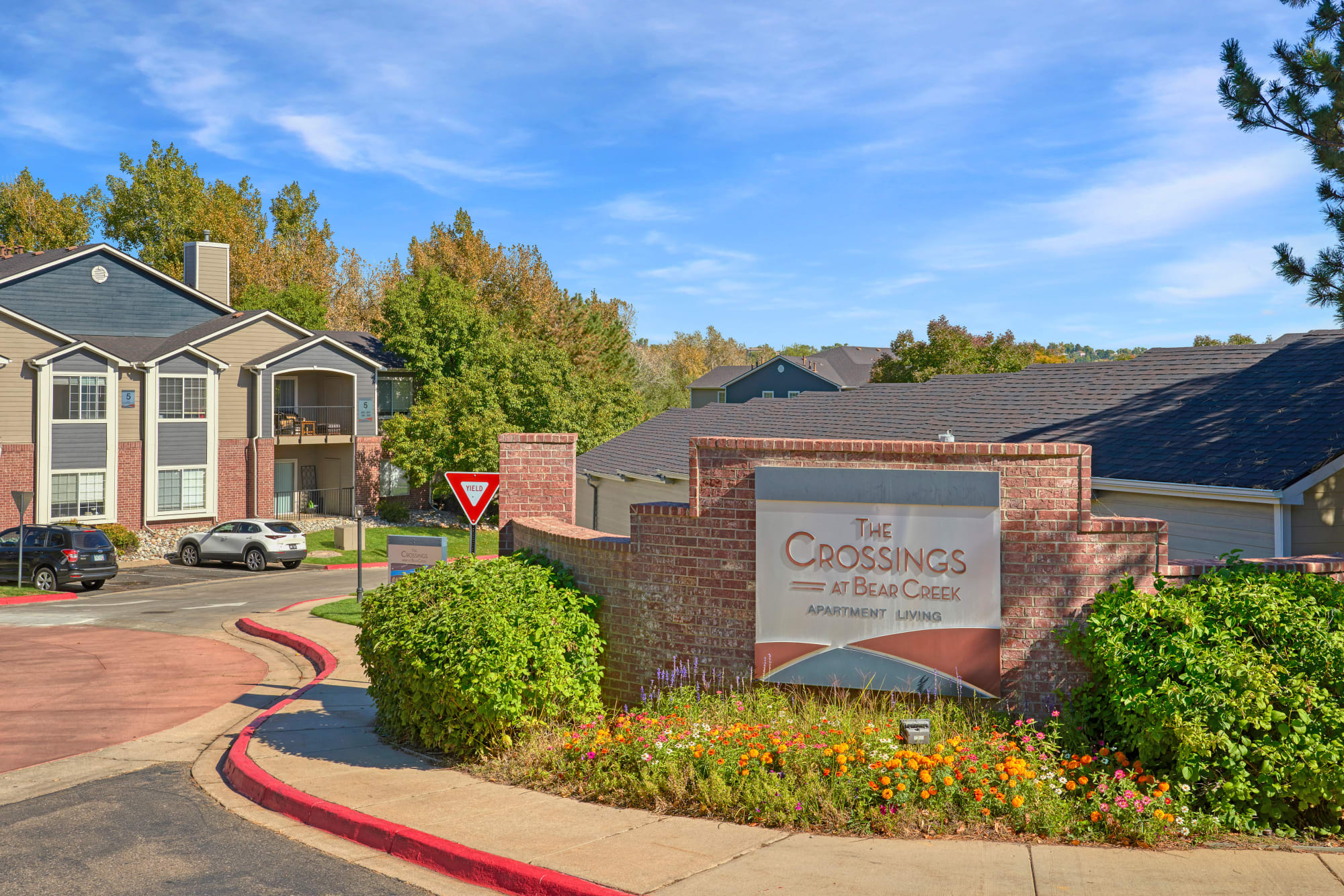 The monument sign at The Crossings at Bear Creek Apartments in Lakewood, Colorado
