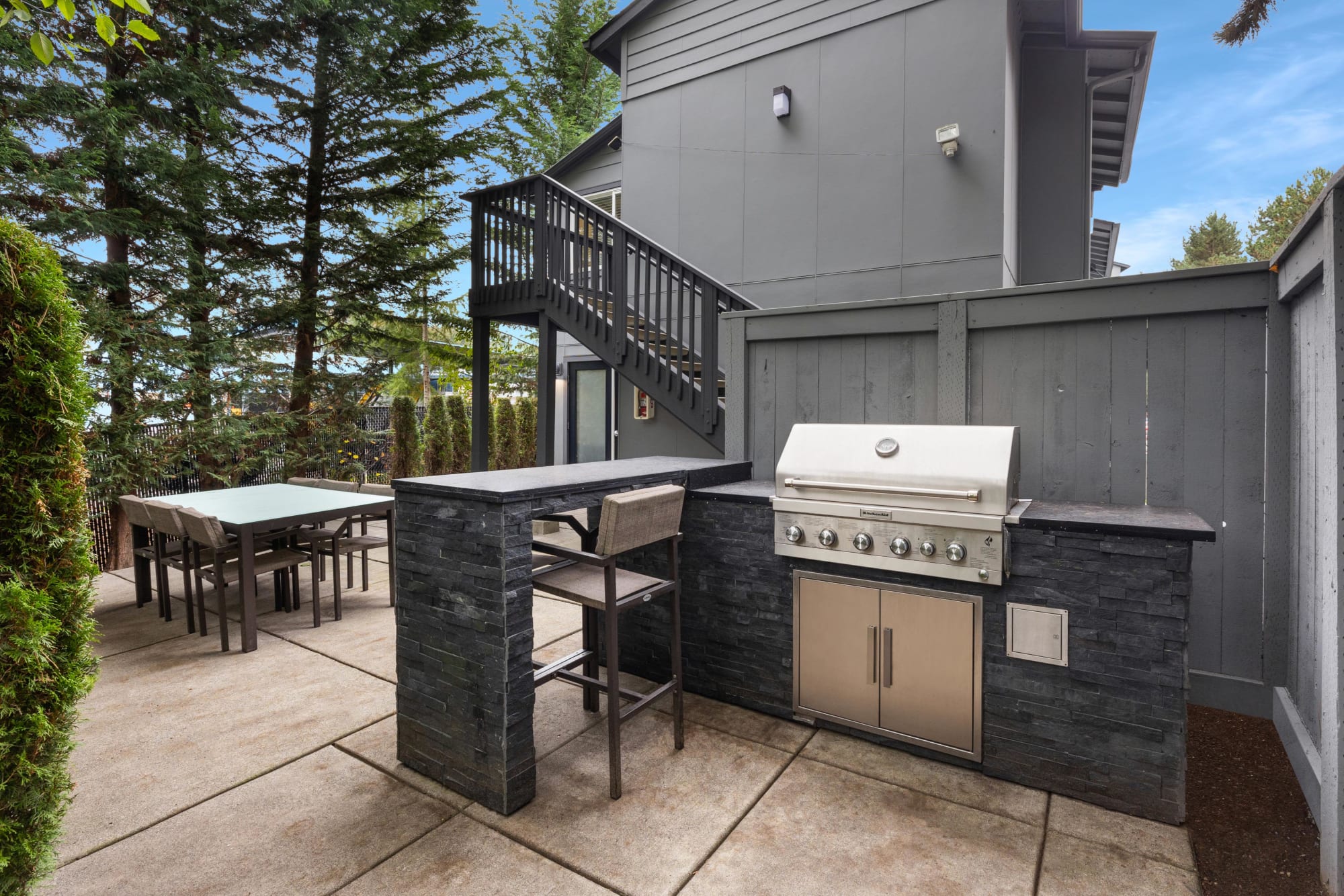 Outdoor BBQ area at Karbon Apartments in Newcastle, Washington