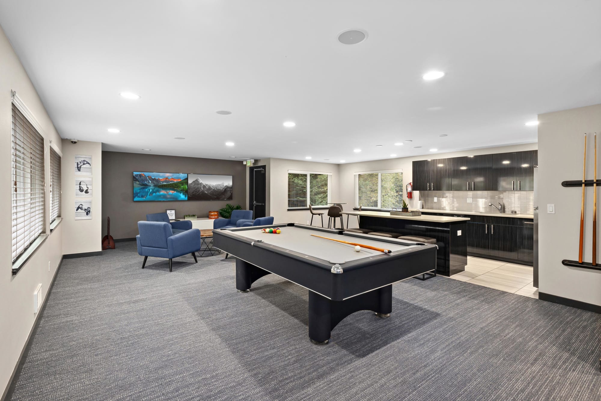 Game room with a pool table at Karbon Apartments in Newcastle, Washington