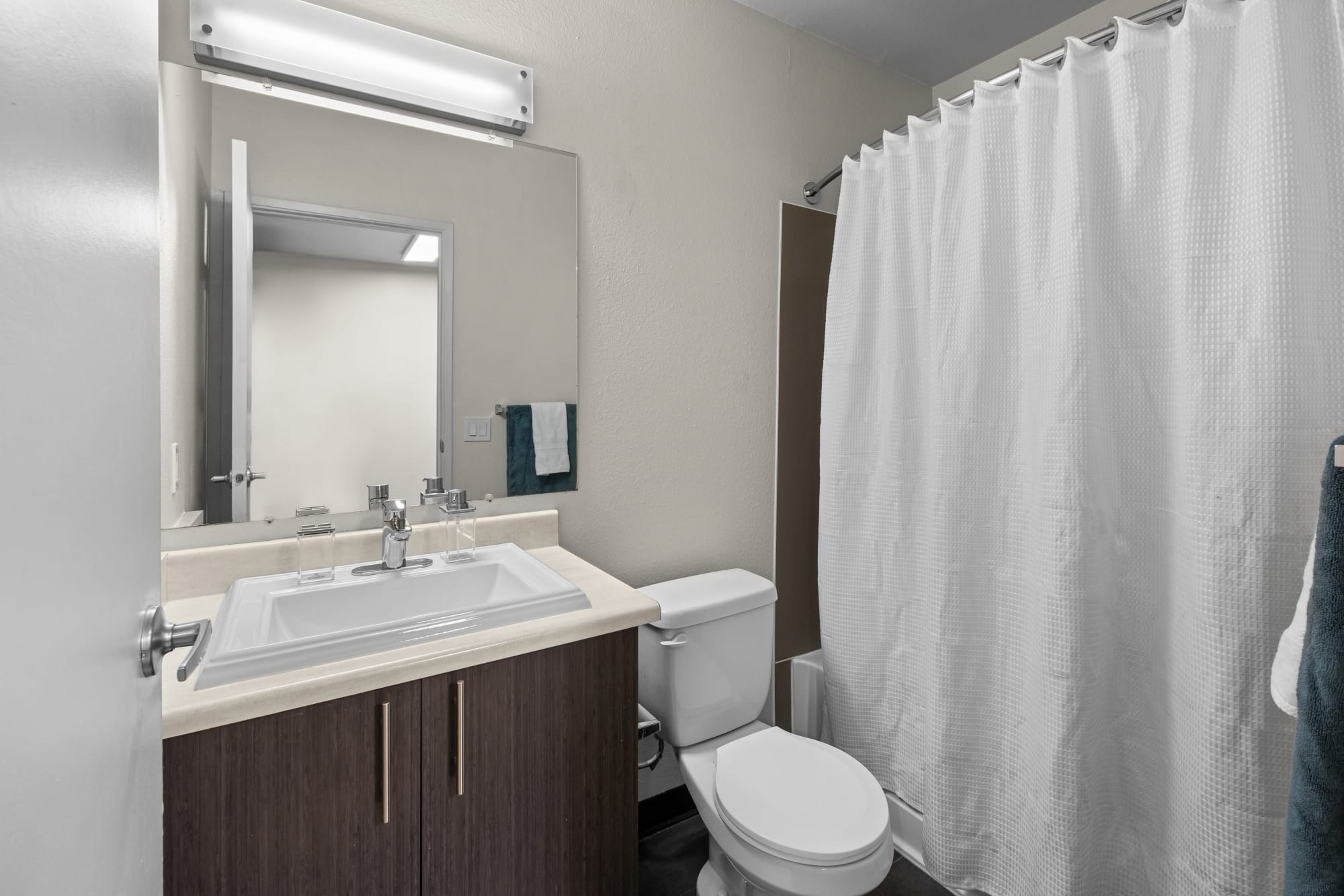 Bathroom with a tub at Karbon Apartments in Newcastle, Washington